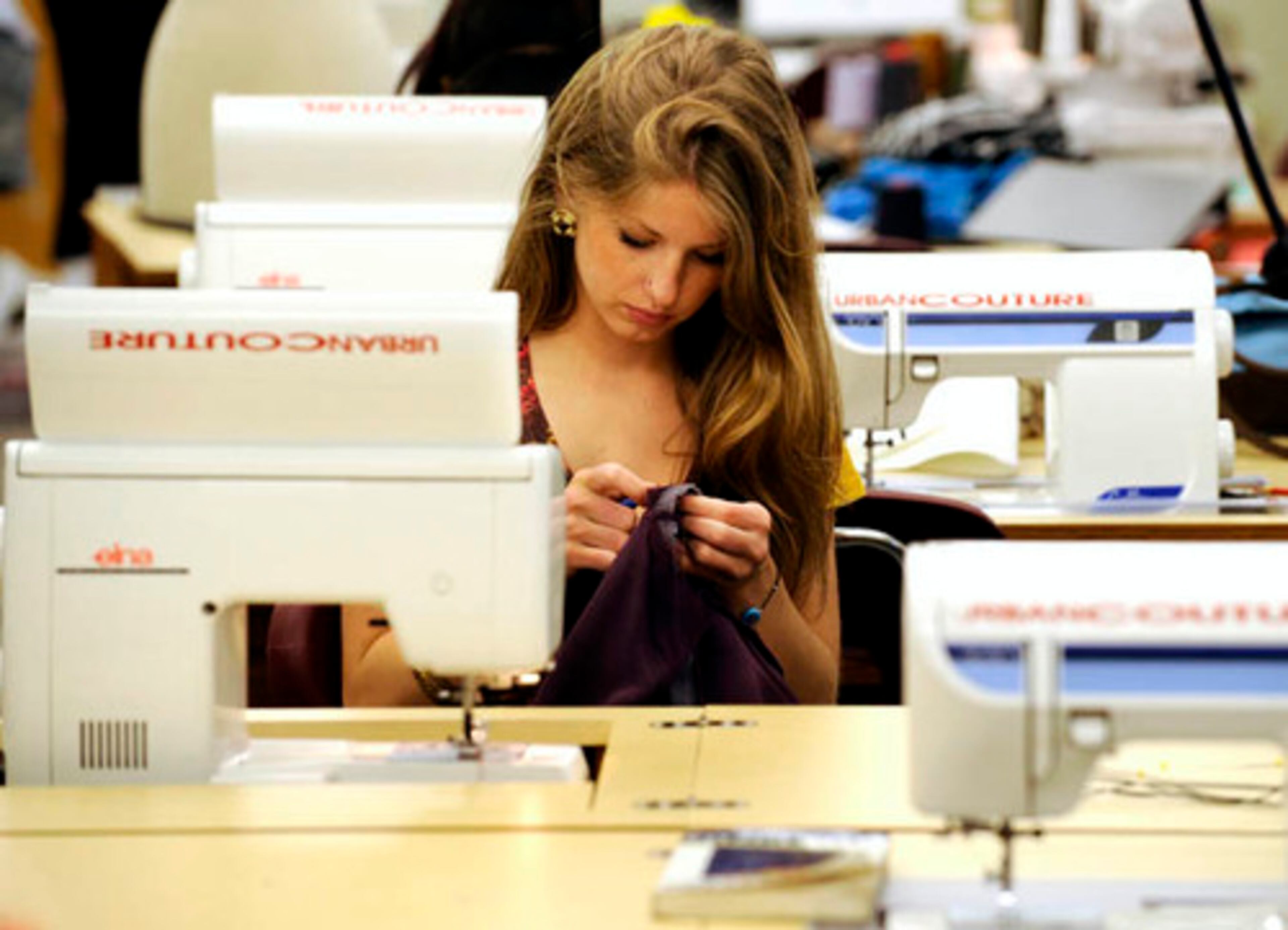 Caitlin Garcia-Ahern, a senior, works on her outfit for the fashion show. Her style? "Fresh and lovely."