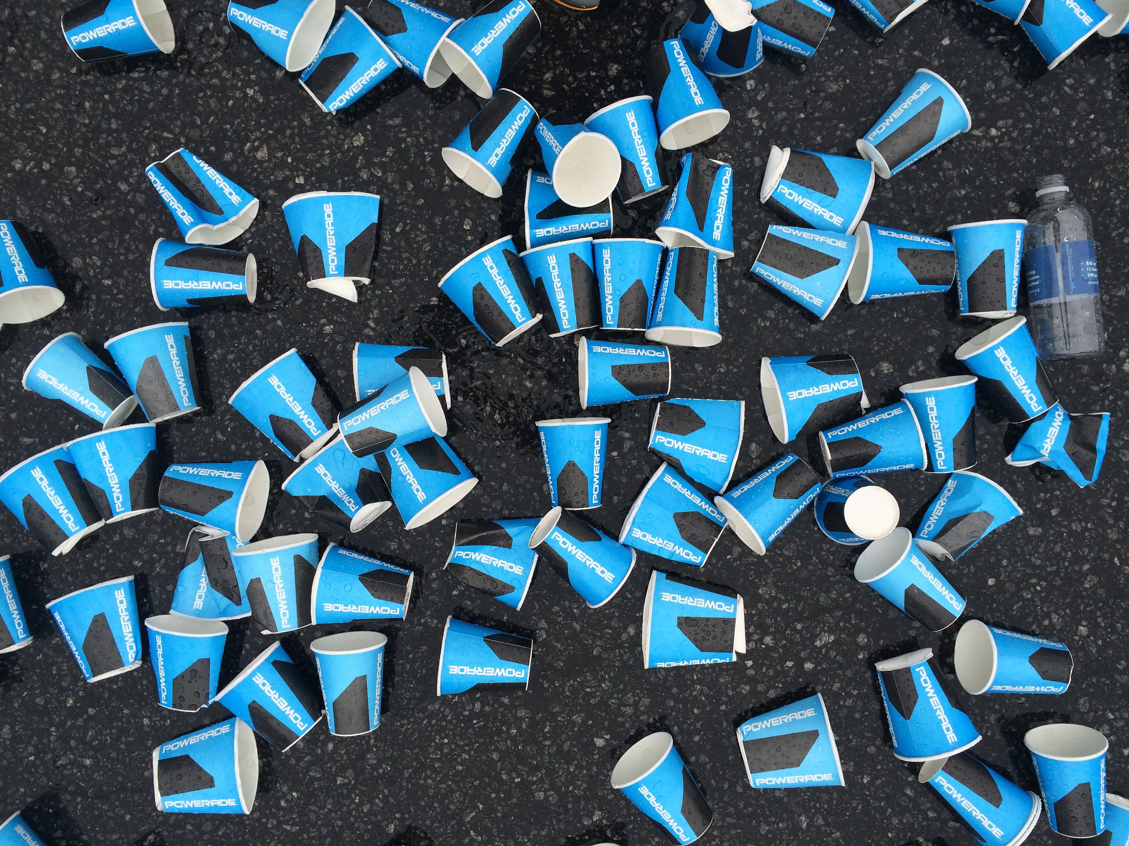 July 4, 2015 Atlanta: Water cups litter Peachtree Road during the AJC Peachtree Road Race on Saturday July 4, 2015.