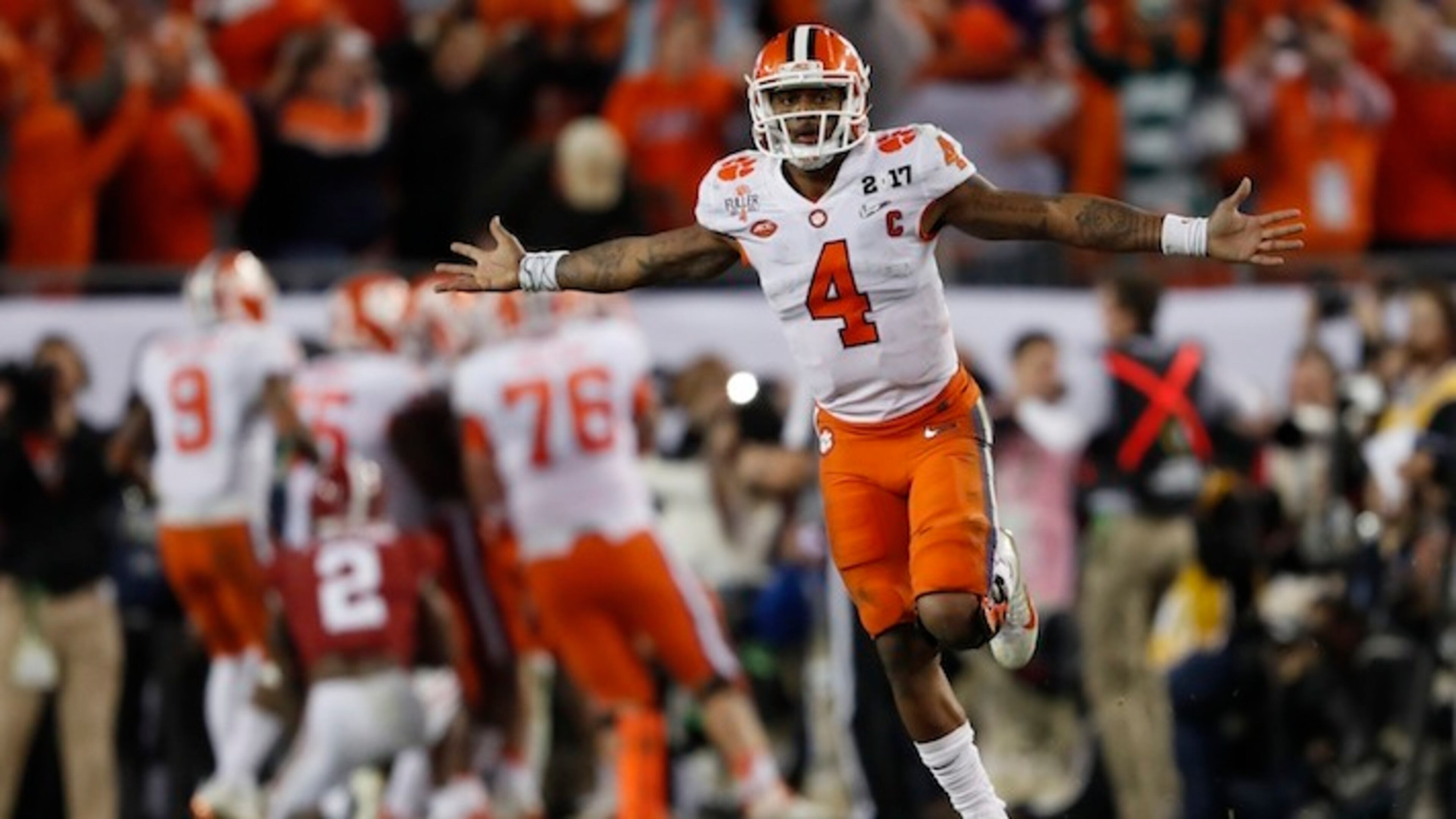 Clemson's Deshaun Watson celebrates a last second touchdown pass to Hunter Renfrow during the second half of the NCAA college football playoff championship game against Alabama Tuesday, Jan. 10, 2017, in Tampa, Fla. (AP Photo/John Bazemore)