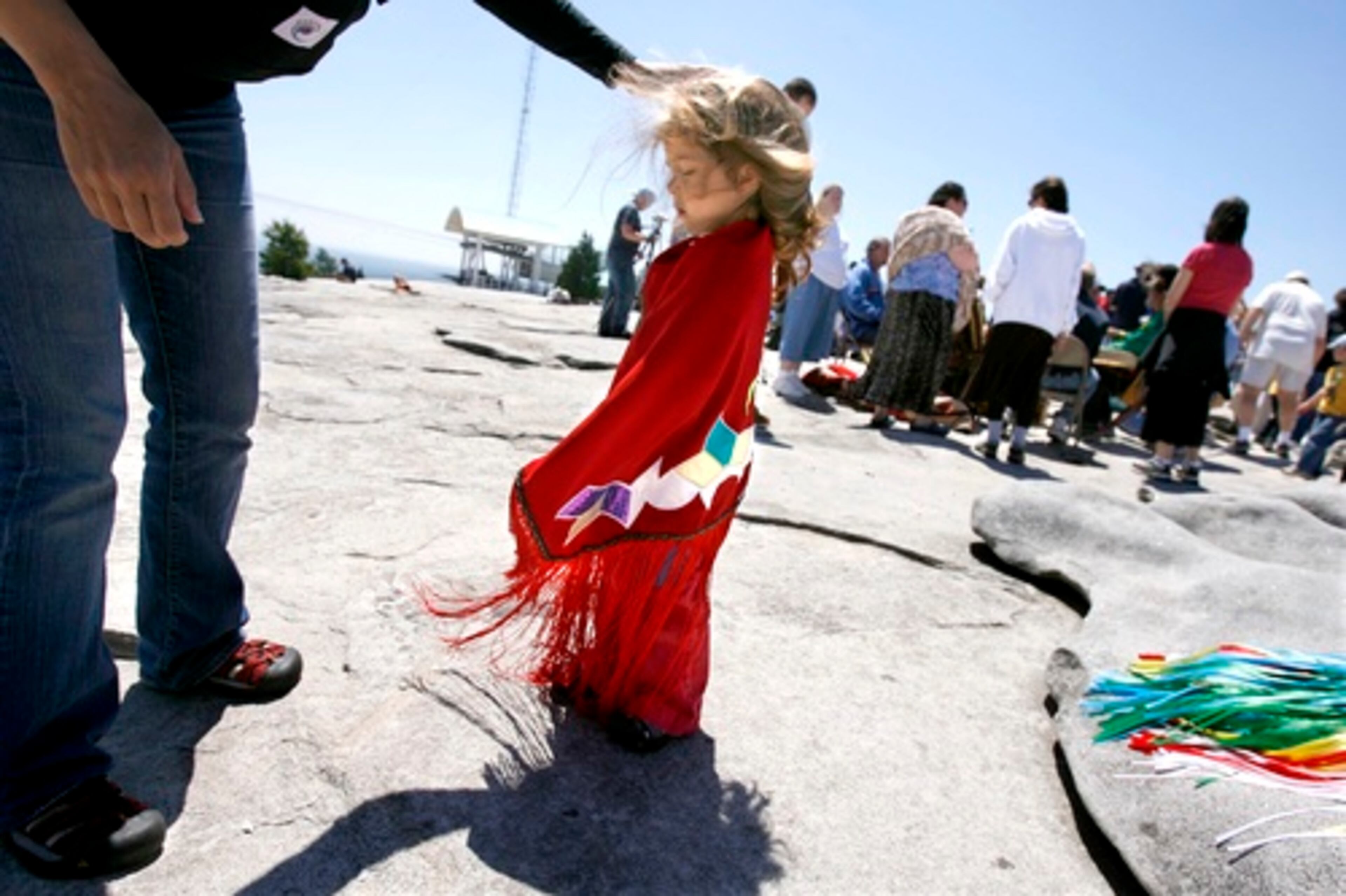 Annamaria Silverthorn, 2,of Atlanta, was among the youngest to participate. Her father is also performing in a similar ceremony in Louisville, Ga. At left is her mother Michelle.