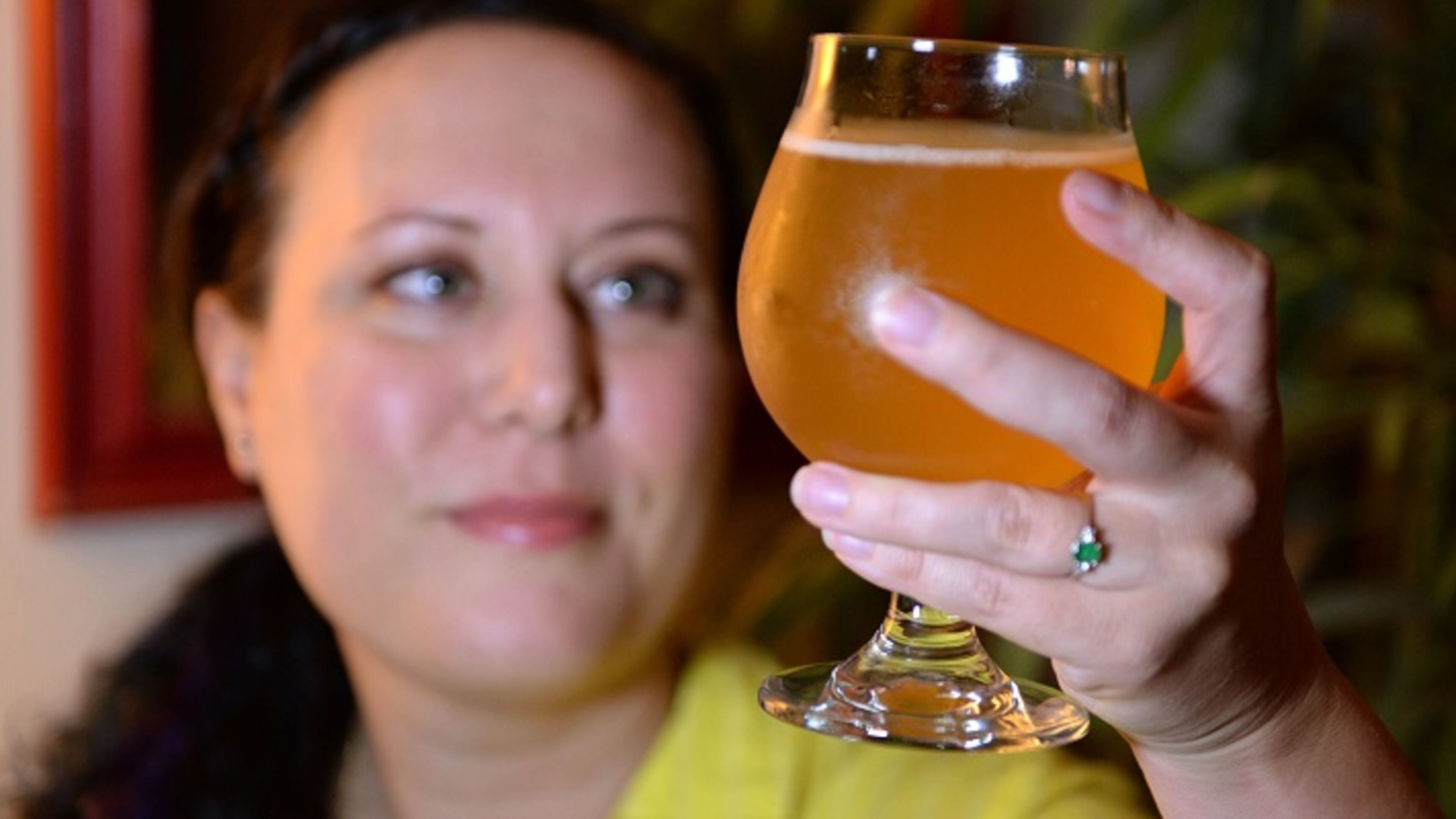 Jen Blair holds a glass of the finished grisette that she began brewing on June 17, 2017. She is a home brewer who just accepted a job in the beer industry as the executive director of the Craft Maltsters Guild of North America. (Jenna Eason/Charlotte Observer/TNS)