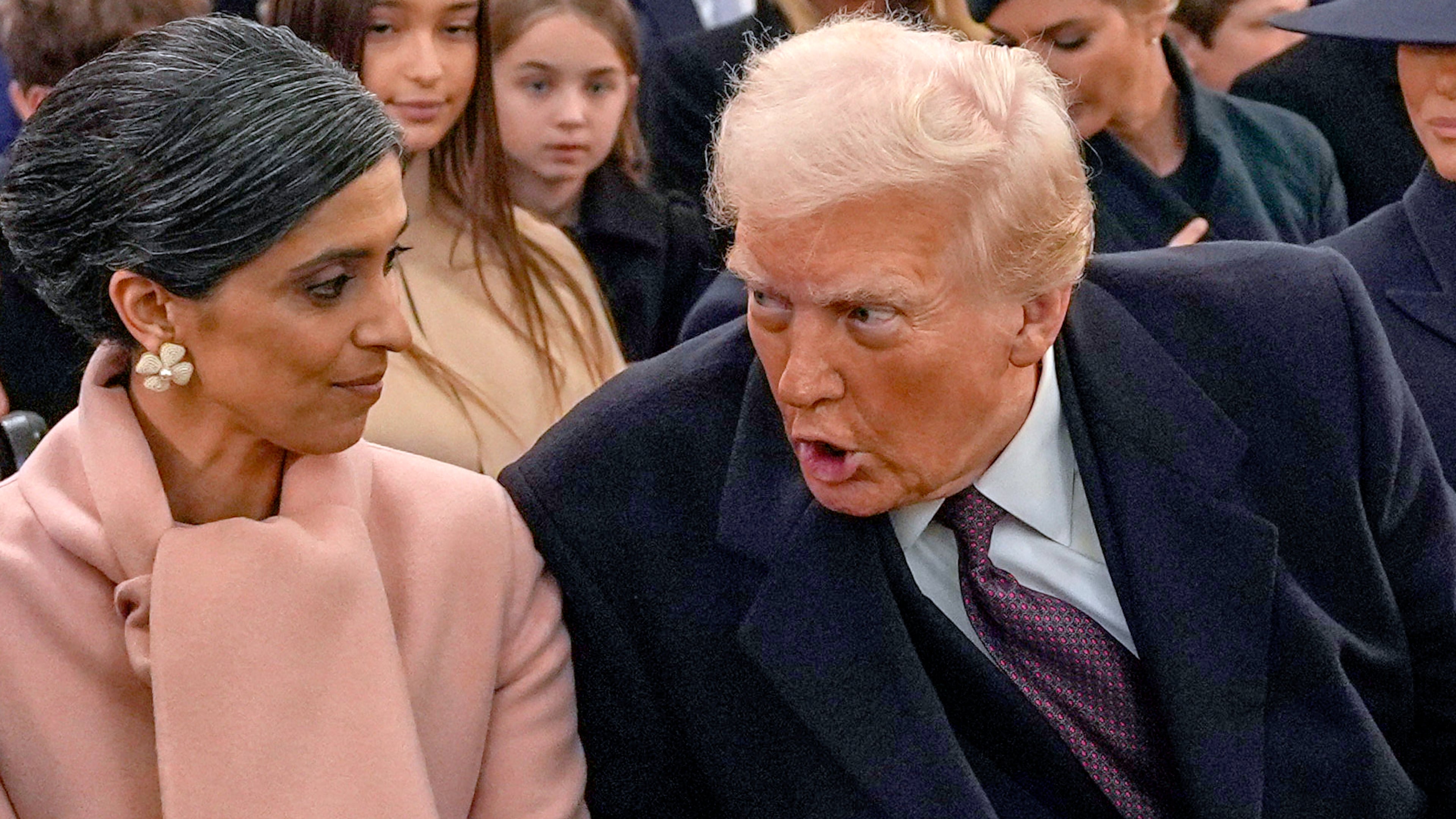 FILE - President-elect Donald Trump, from right, talks with Usha Vance and Vice President-elect JD Vance, not pictured, before a service at St. John's Church, Jan. 20, 2025, in Washington. (AP Photo/Evan Vucci, File)
