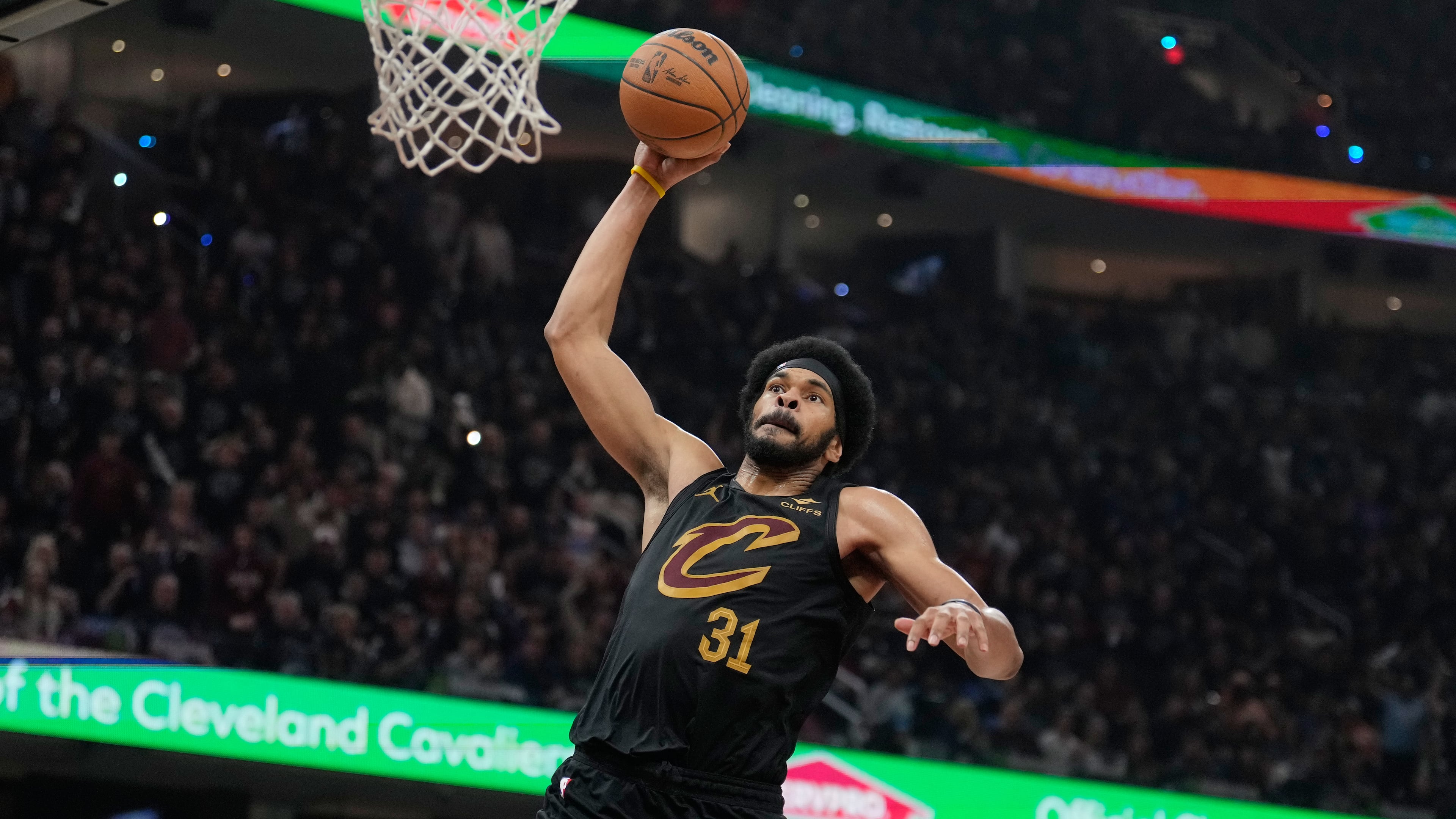 Cleveland Cavaliers center Jarrett Allen (31) goes up for a dunk in the second half in Game 7 of a first-round NBA basketball playoffs series agaist the Toronto Raptors in Cleveland, Sunday, May 3, 2026. (AP Photo/Sue Ogrocki)