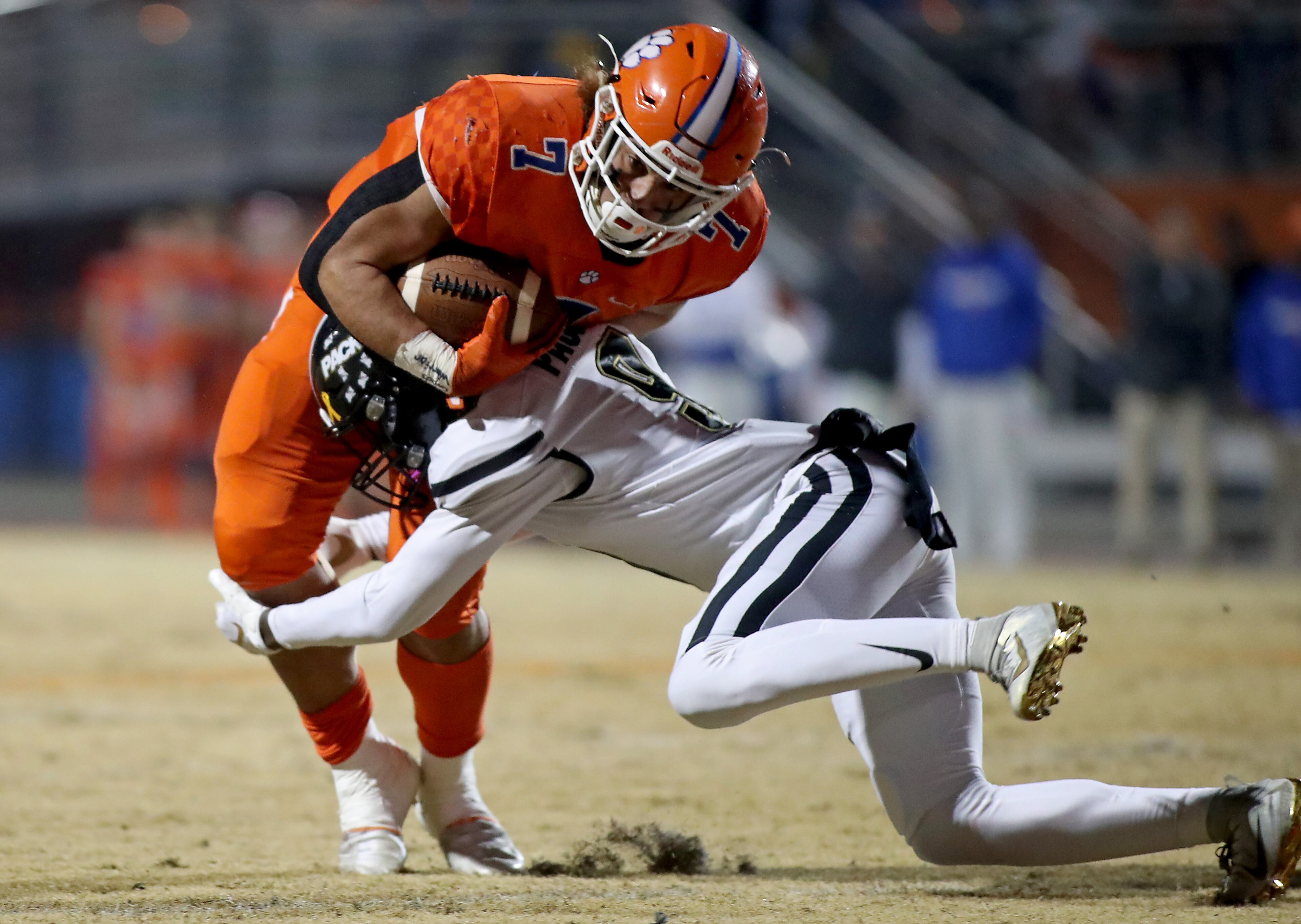 Cody Brown (7) is tackled by Colquitt County linebacker Zy Brockington (8) in the first half of Friday's game in Lilburn. (Jason Getz/Special)