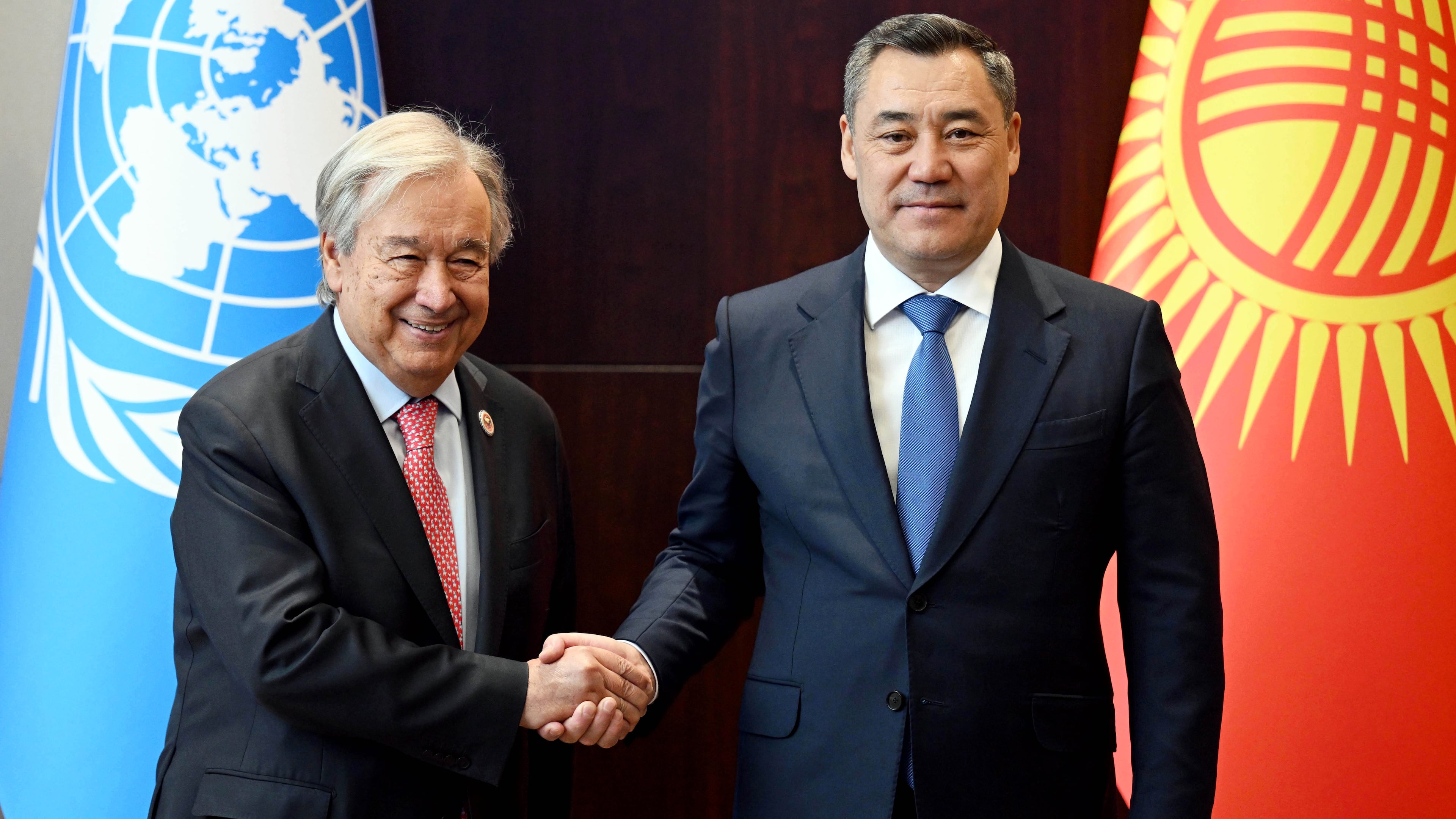 In this photo provided by Kyrgyzstan's Presidential Press Office, United Nations Secretary-General Antonio Guterres, left, and Kyrgyz President Sadyr Zhaparov shake hands during their meeting on the sidelines of the Shanghai Cooperation Organization (SCO) Summit in Bishkek, Kyrgyzstan, Monday, Aug. 31, 2026. (Sultan Dosaliev/Kyrgyzstan's Presidential Press Office via AP)
