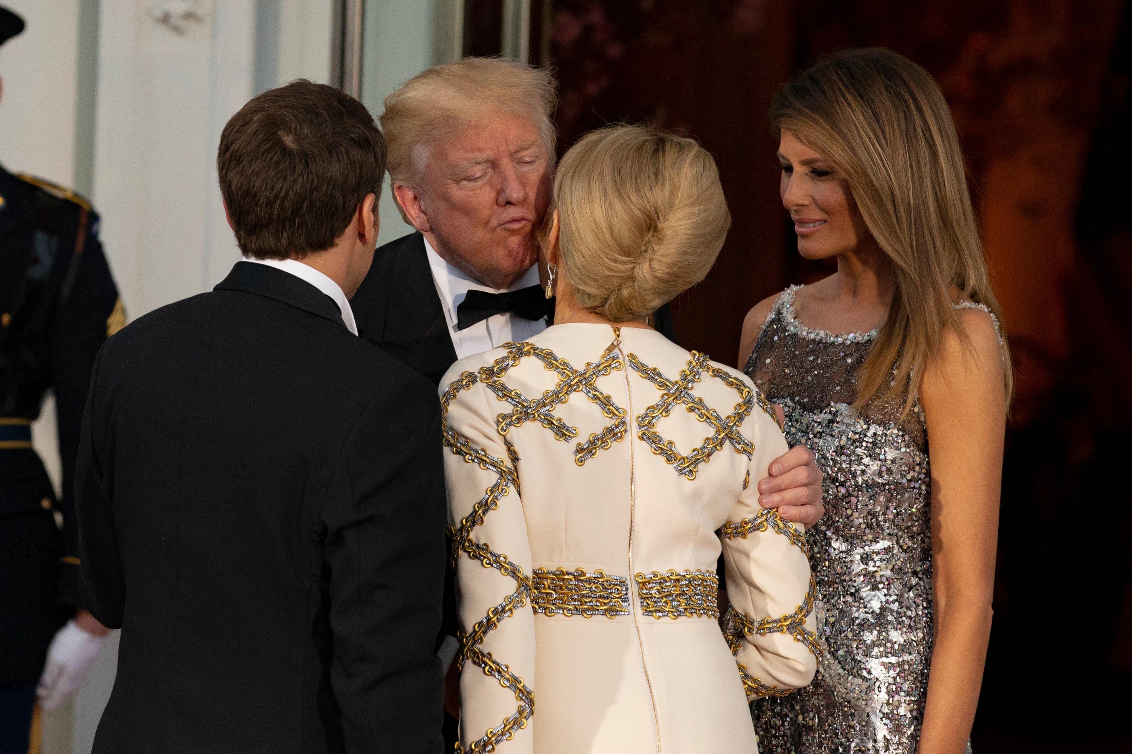 WASHINGTON, DC - APRIL 24: U.S President Donald Trump and U.S. first lady Melania Trump greet French President Emmanuel Macron and French first lady Brigitte Macron after their arrival at the North Portico before a State Dinner at the White House, April 24, 2018 in Washington, DC. Trump is hosting Macron for a two-day official visit that included dinner at George Washington's Mount Vernon, a tree planting on the White House South Lawn and a joint news conference. (Photo by Alex Edelman-Pool/Getty Images)