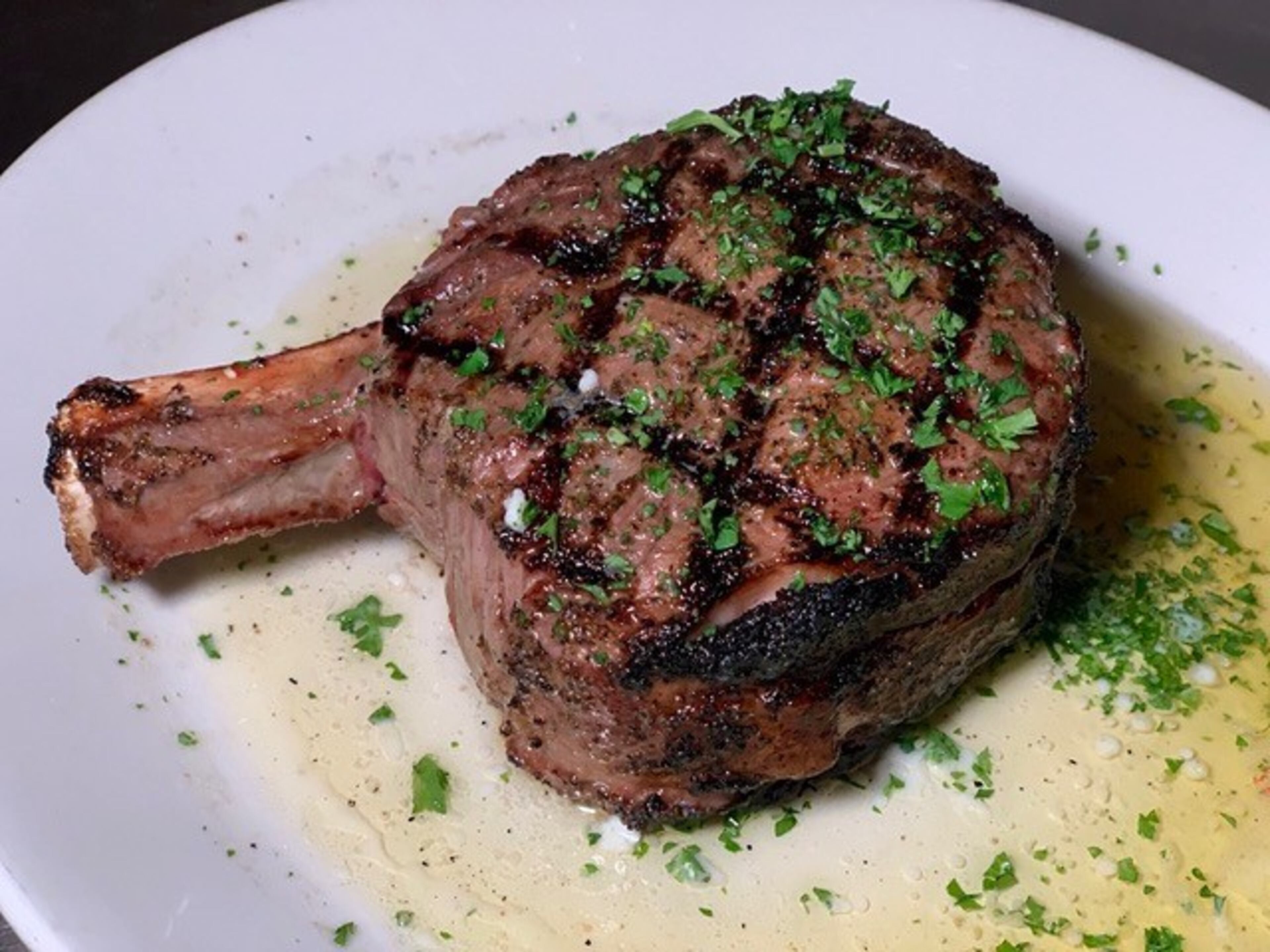 The steaks, including the bone-in rib-eye, are one of the strengths at Nowak's Sandy Springs. Courtesy of Nowak's Sandy Springs