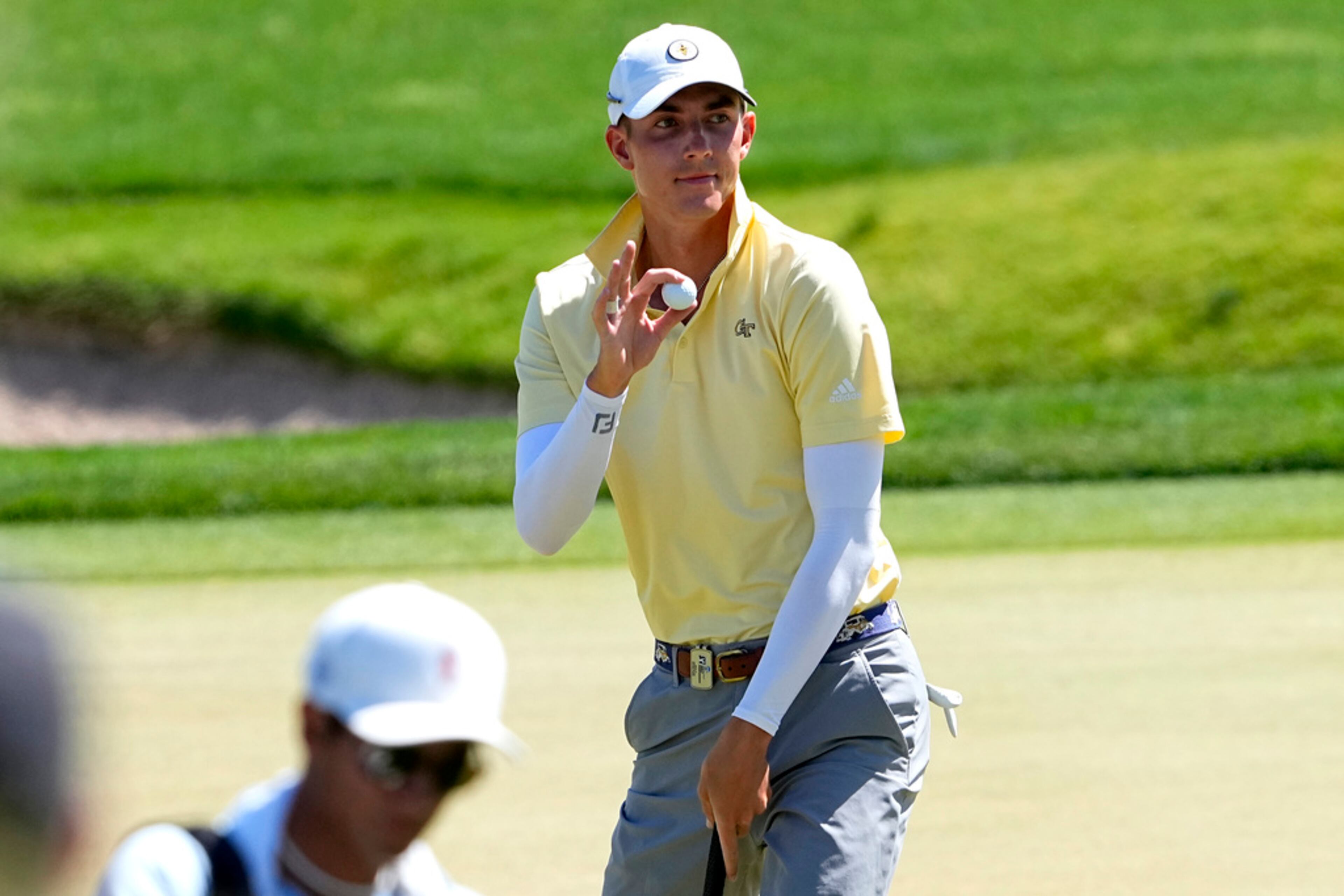 Georgia Tech golfer Ross Steelman waves after making his shot on the second green during the final round of the NCAA college men's match play golf championship, Wednesday, May 31, 2023, in Scottsdale, Ariz. (AP Photo/Matt York)