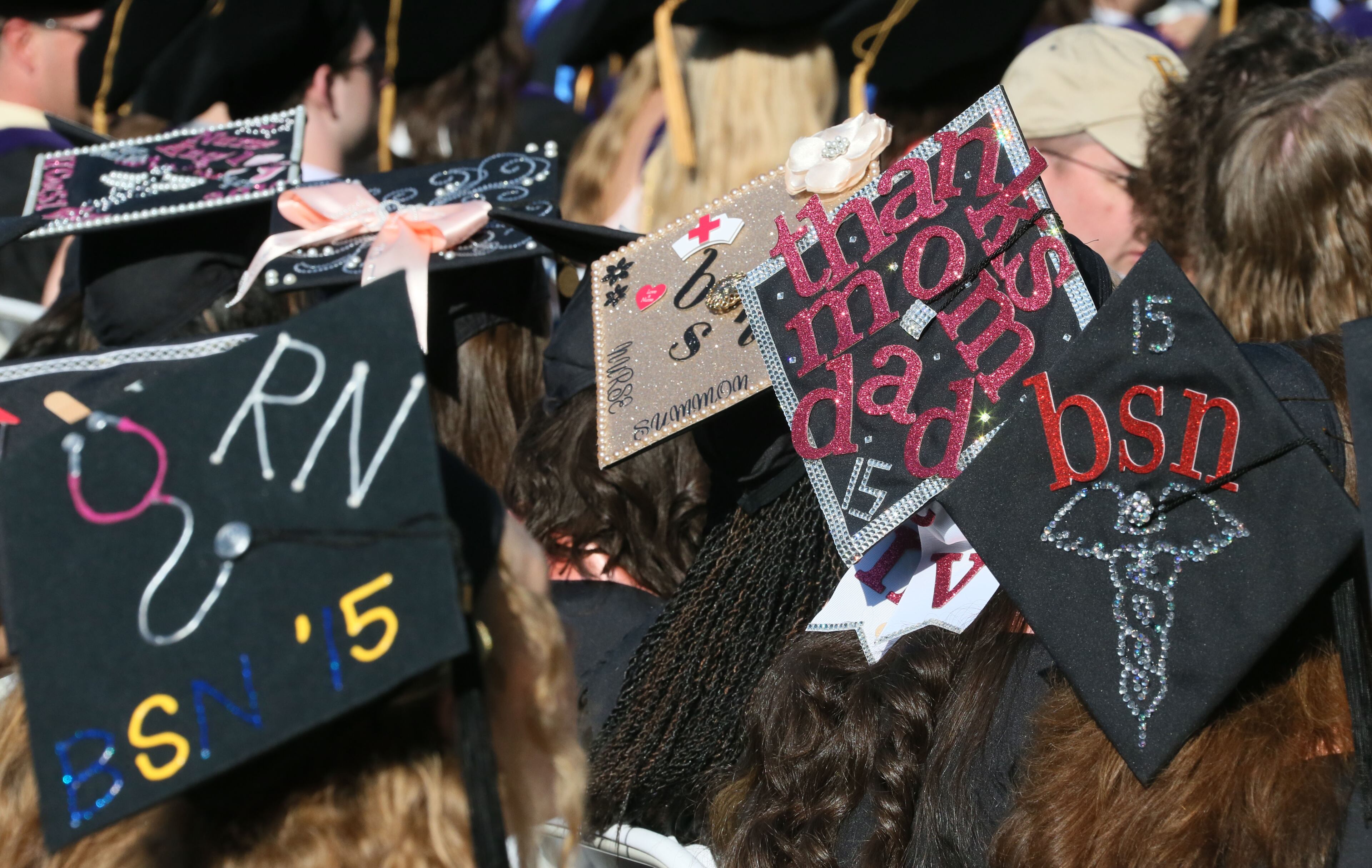 Emory 2015: School of Nursing graduates displayed a bedazzled caduceus symbol and thanked their parents. (Bob Andres/AJC 2015 file)