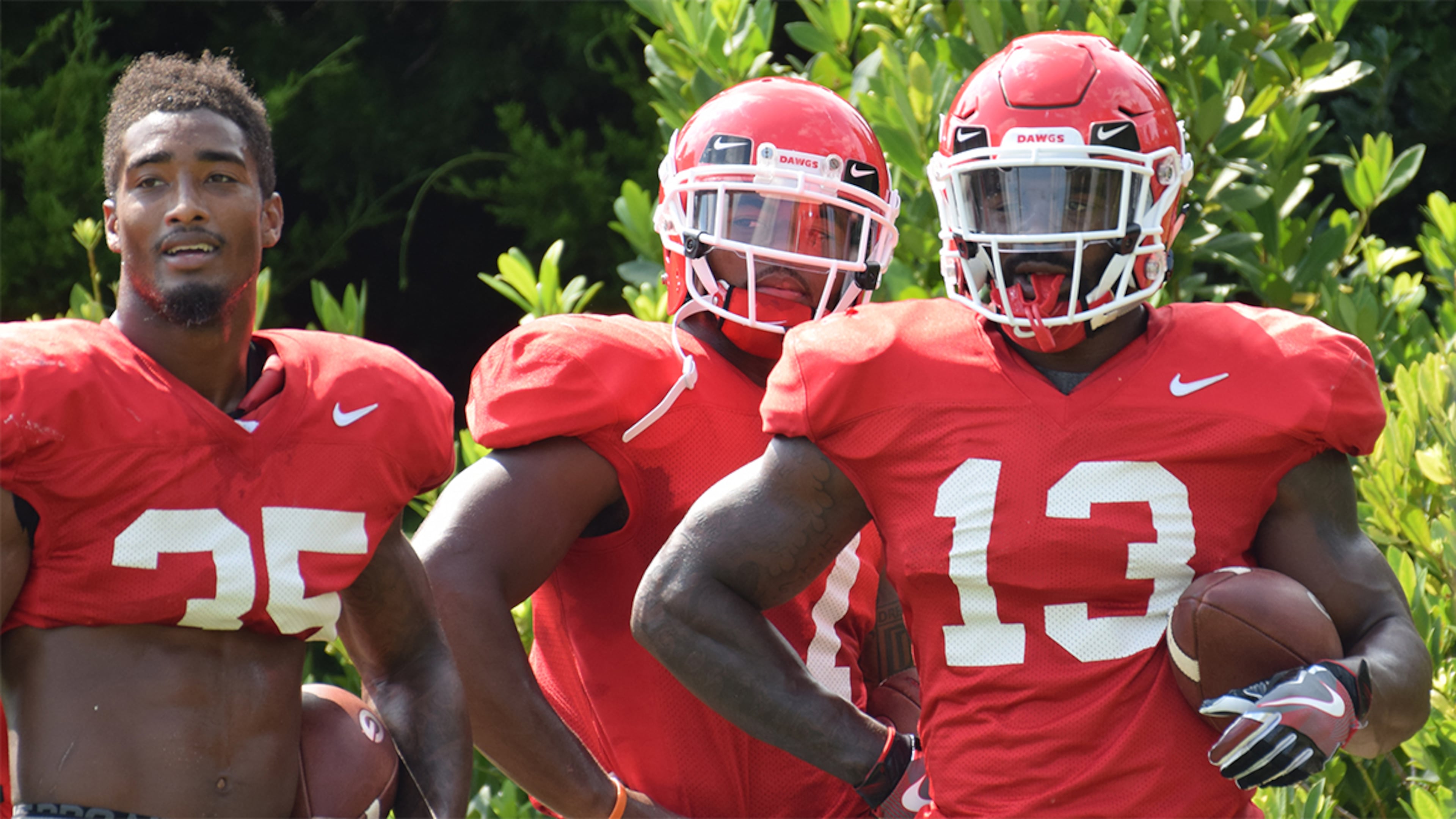 Georgia tailbacks Brian Herrien (35), D'Andre Swift (7) and Elijah Holyfield (13) during the Bulldogs' practice Tuesday, Aug. 21, 2018, on the Woodruff Practice Fields in Athens.