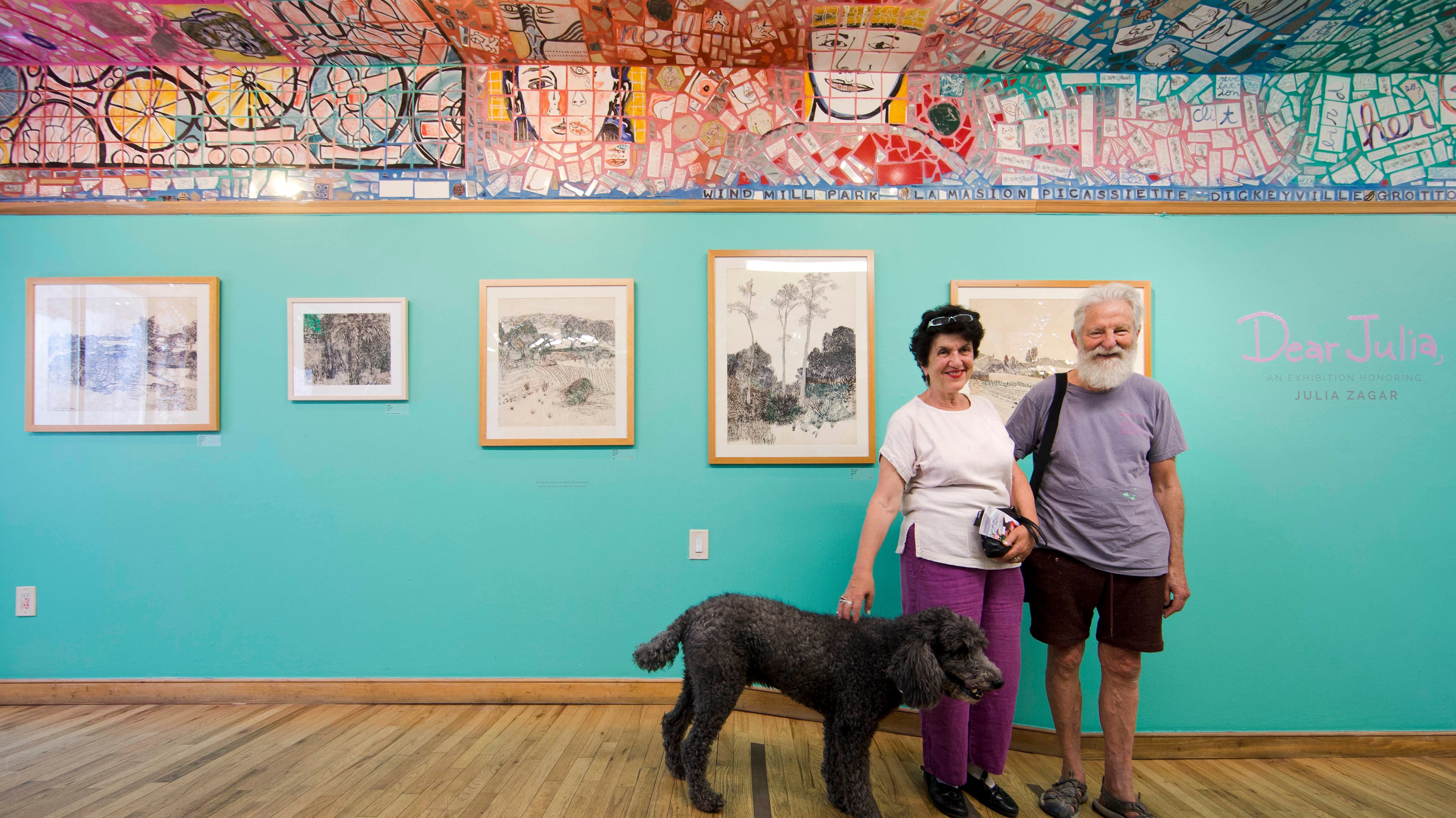 FILE - Julia Zagar, left, and her husband Isaiah Zagar pose for a photo with their dog Blue at the "Dear Julia" exhibit at Philadelphia's Magic Gardens May 26, 2016, in Philadelphia. (AP Photo/Matt Rourke, File)