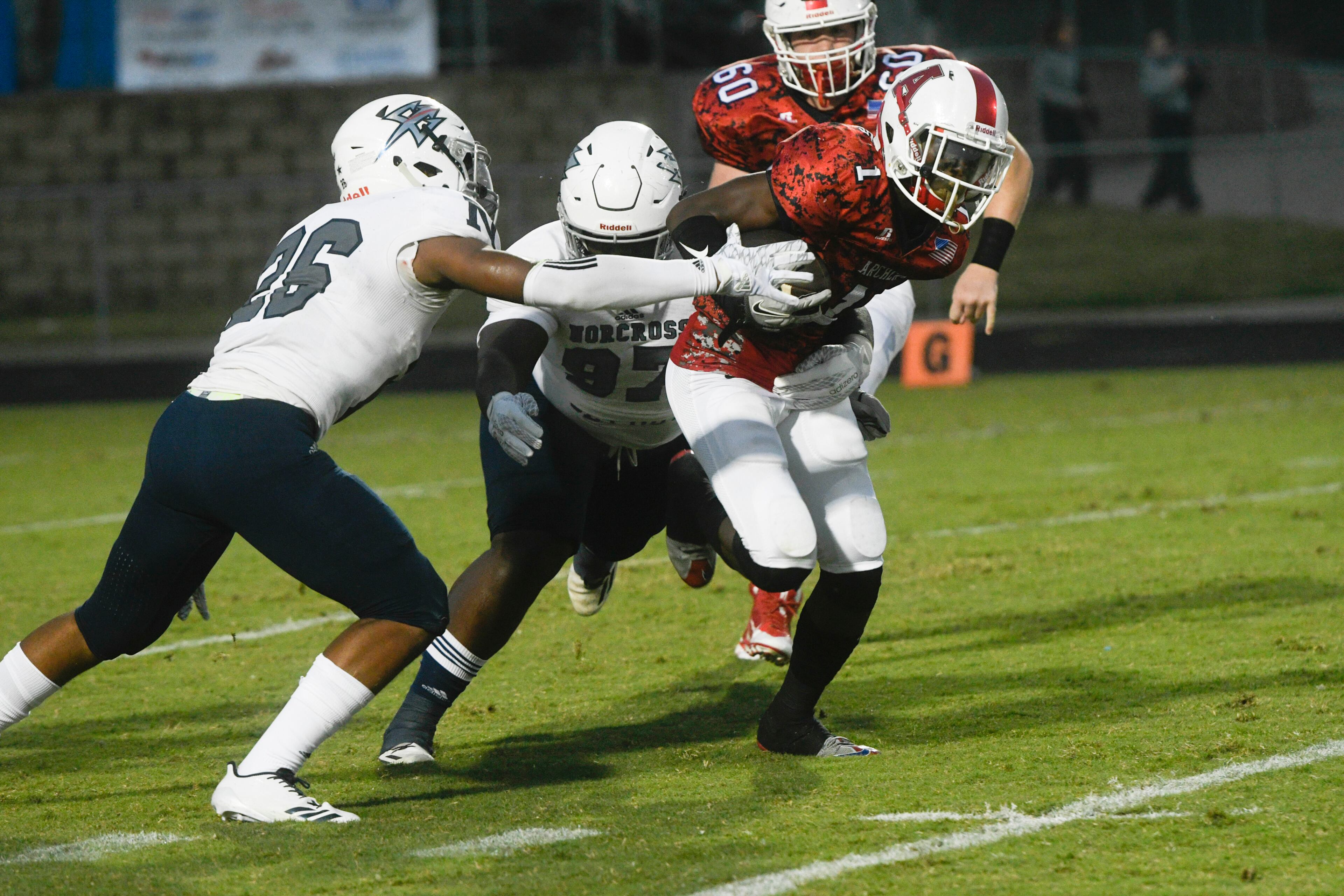 Archer QB Braylen Weems, right, runs with the ball as Archer LB Jaren Wicker (26) and Nazir Sy (97) defend during a high school football game, Friday, Sept. 15, 2017, in Lawrenceville. (Special/John Amis)