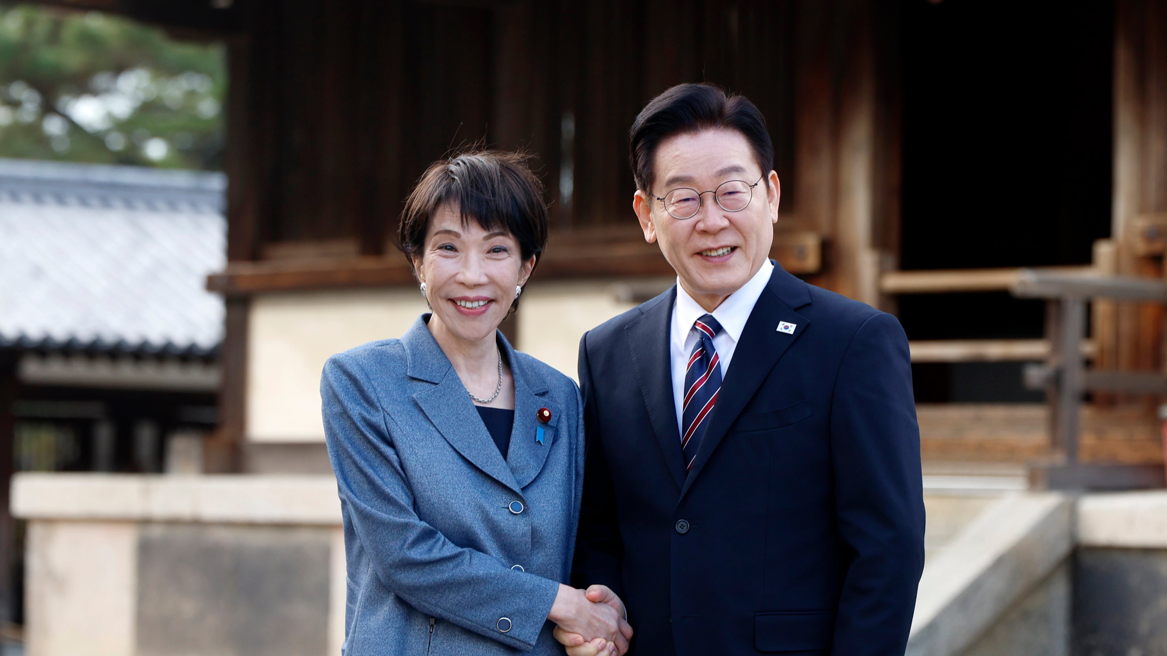 Japanese Prime Minister Sanae Takaichi, left, and South Korean President Lee Jae Myung pose for photographs as they visit the Western Precinct or Saiin Garan, at the Horyuji Temple in Ikaruga, Nara prefecture, western Japan, Wednesday, Jan. 14, 2026. (Franck Robichon/Pool Photo via AP)