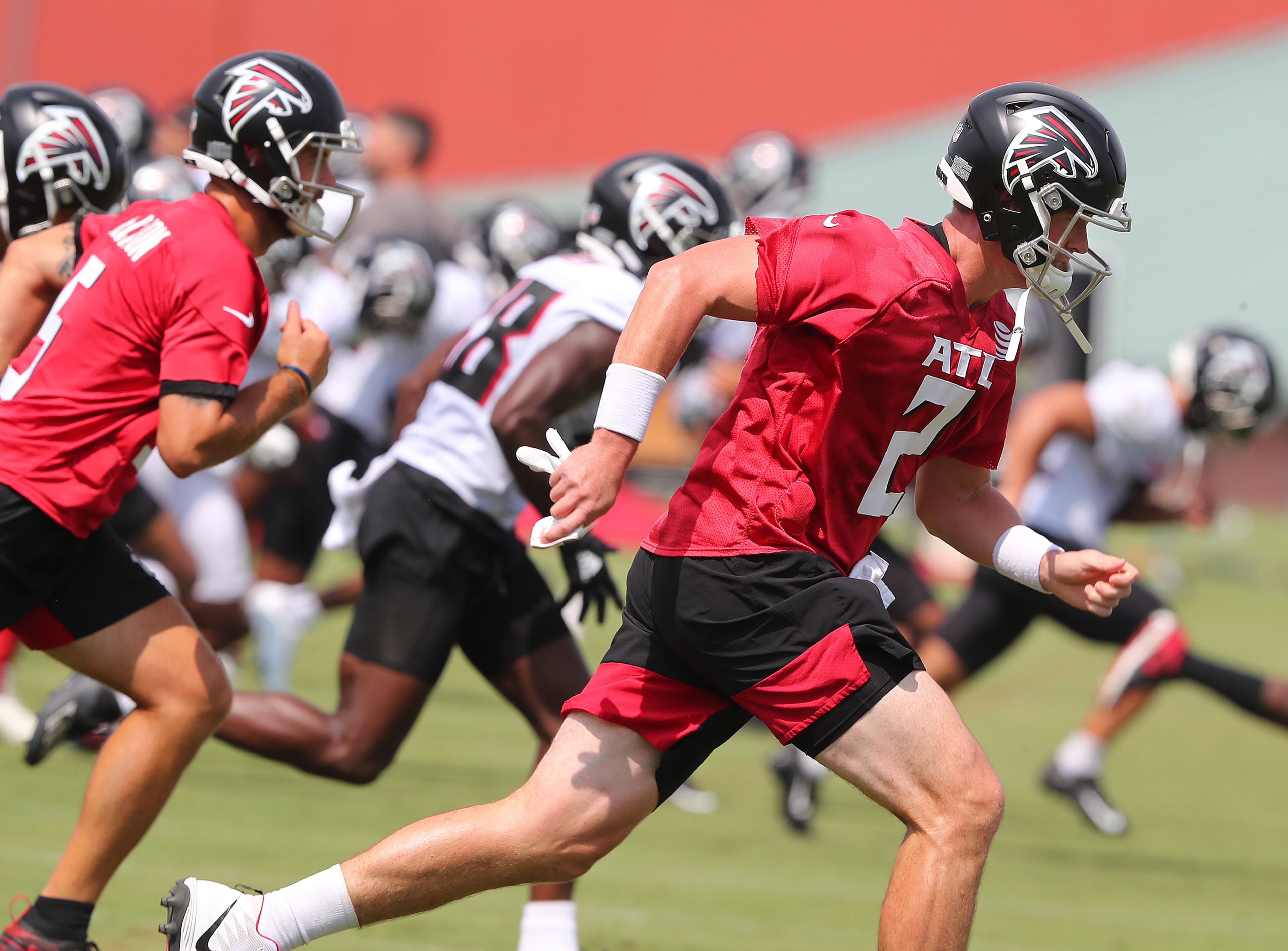 Falcons quarterback Matt Ryan (2) leads the offense in running sprints at the conclusion of the fourth day of training camp practice Sunday, Aug. 1, 2021, in Flowery Branch. (Curtis Compton / Curtis.Compton@ajc.com)