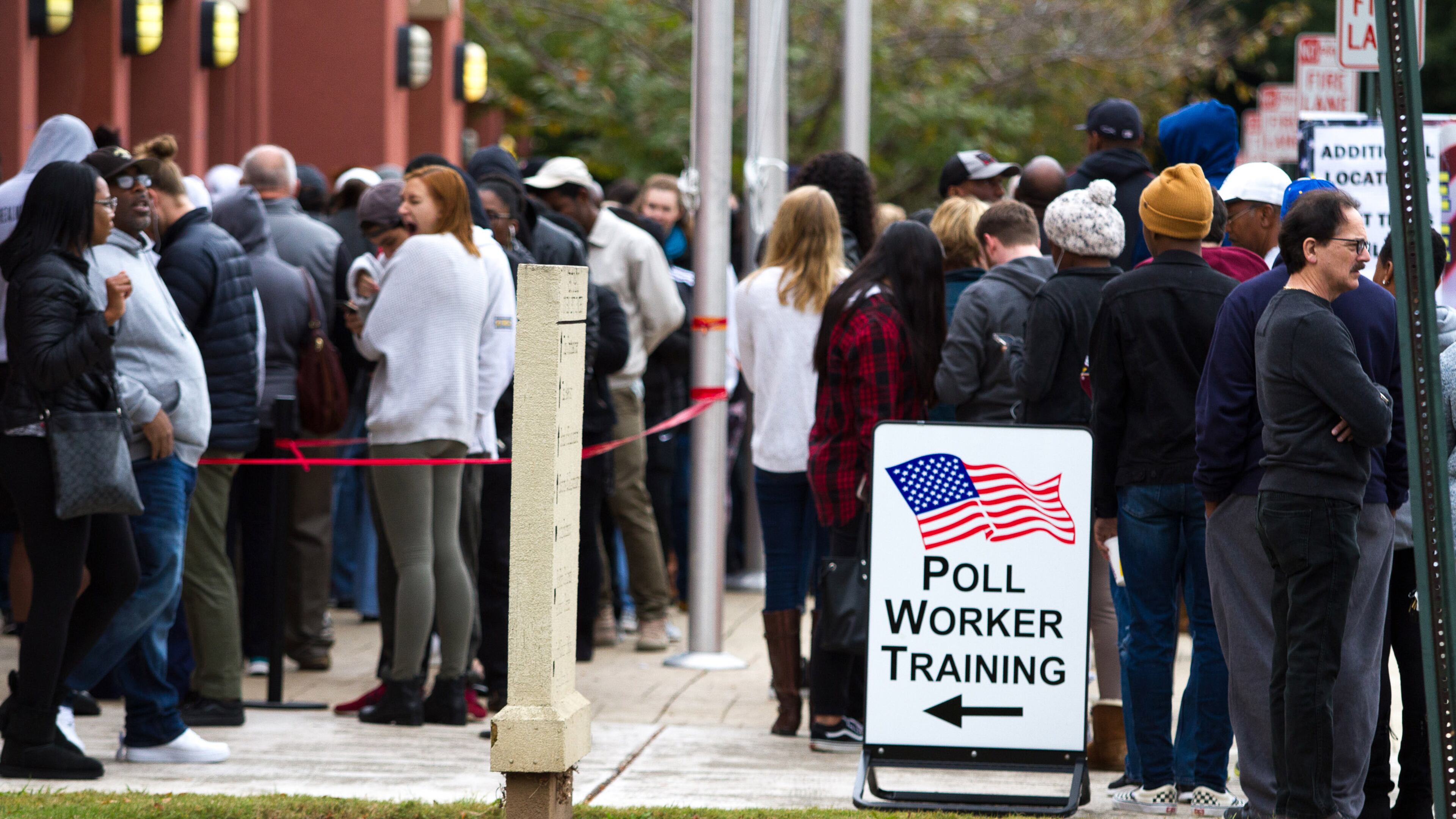 People wait in a long line to vote Saturday at the Cobb County Board of Elections and Registration office in Marietta, GA October 27, 2018. STEVE SCHAEFER / SPECIAL TO THE AJC
