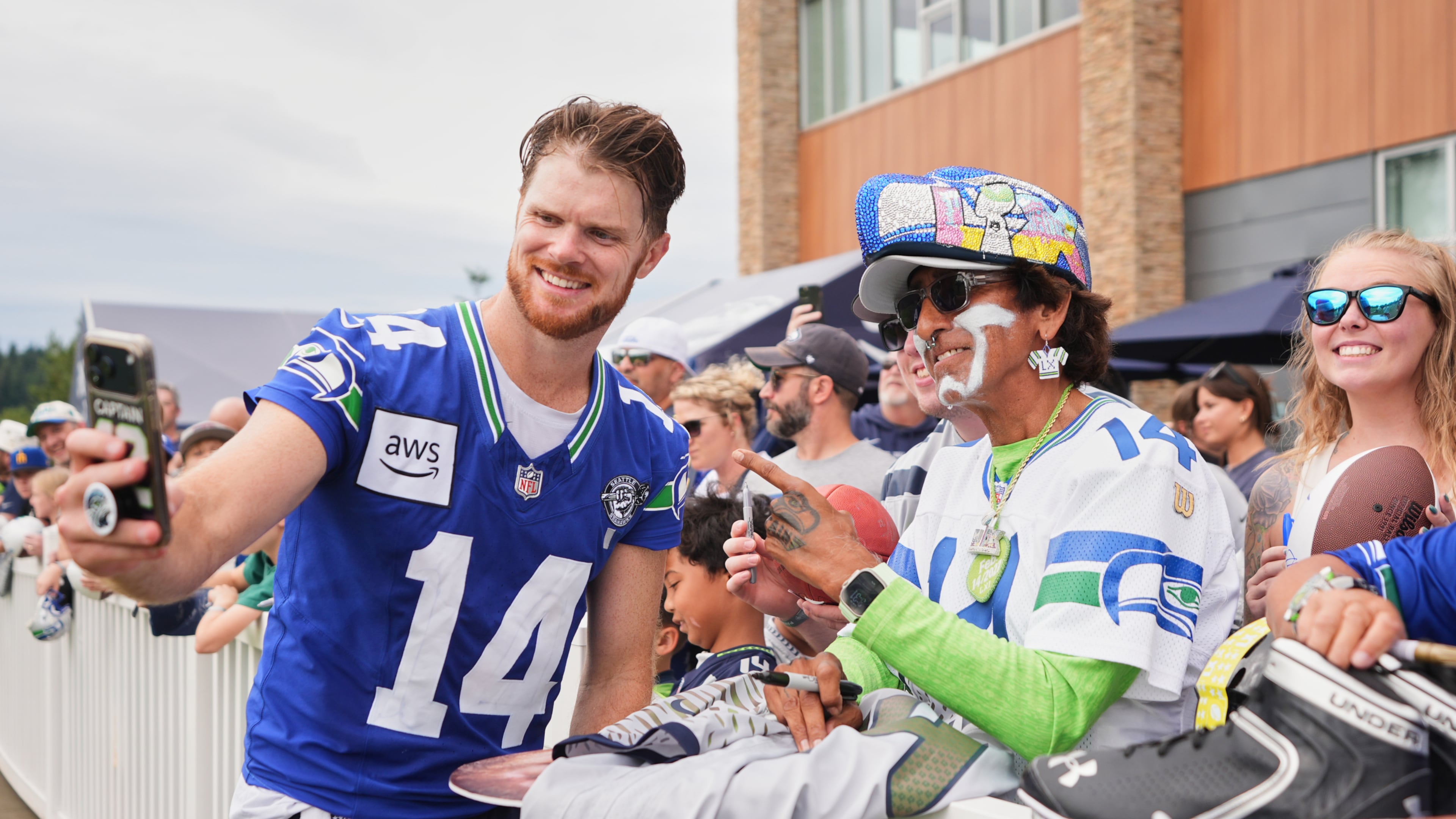 Seattle Seahawks quarterback Sam Darnold takes a selfie during the NFL football team's training camp, Sunday, July 26, 2026, in Renton, Wash. (AP Photo/Lindsey Wasson)