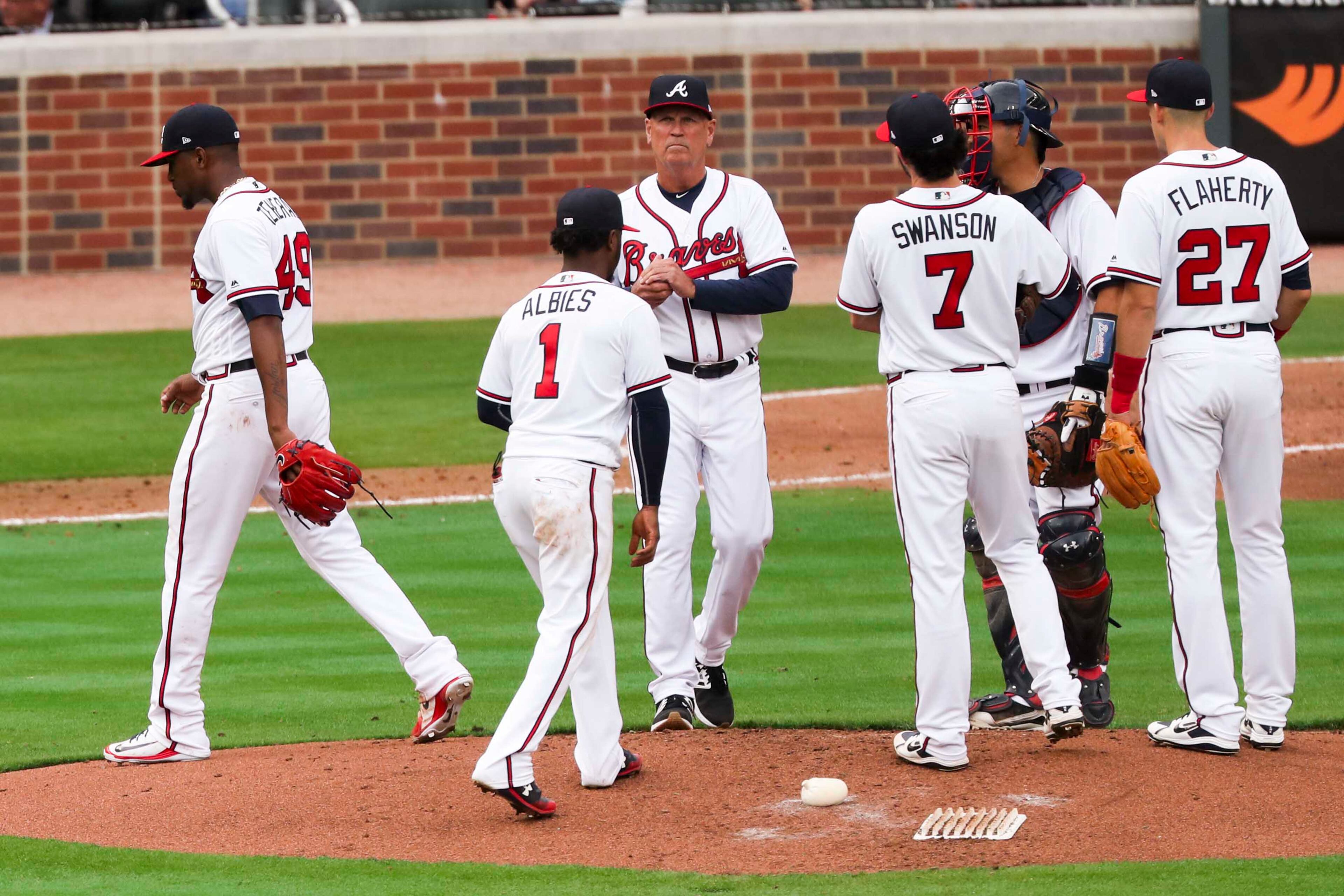 03/29/2018 -- Atlanta, GA - Pitcher Julio Teheran(49) leaves the pitcher's mound and is replaced by Rex Brothers during the season opener game against the Phillies at SunTrust Park, Thursday, March 29, 2018. ALYSSA POINTER/ALYSSA.POINTER@AJC.COM