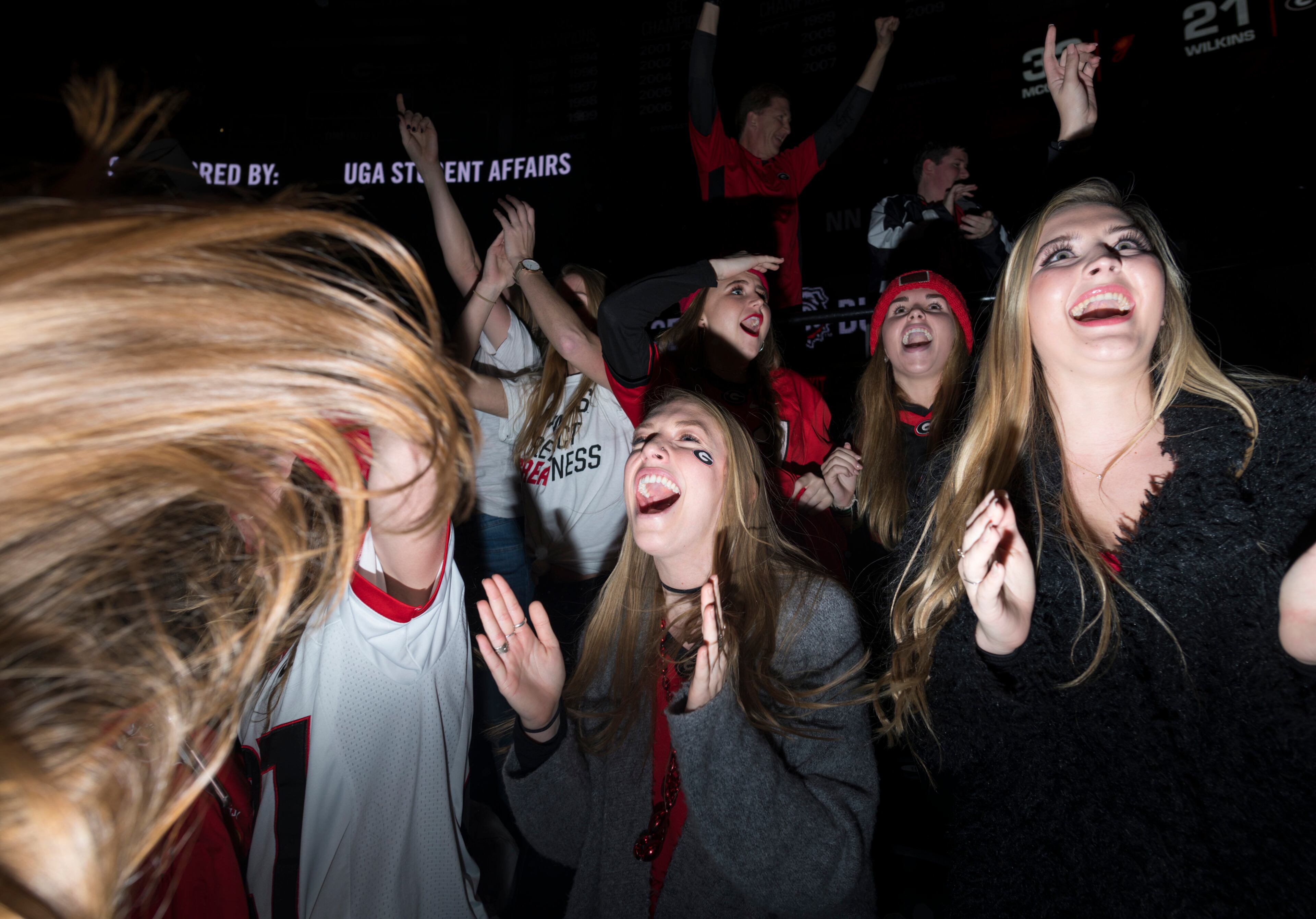 January 8, 2018, Athens - Students cheer while watching the NCAA National Championship game between UGA and Alabama at Stegeman Coliseum in Athens, Georgia, on Monday, January 8, 2018. DAVID BARNES / SPECIAL