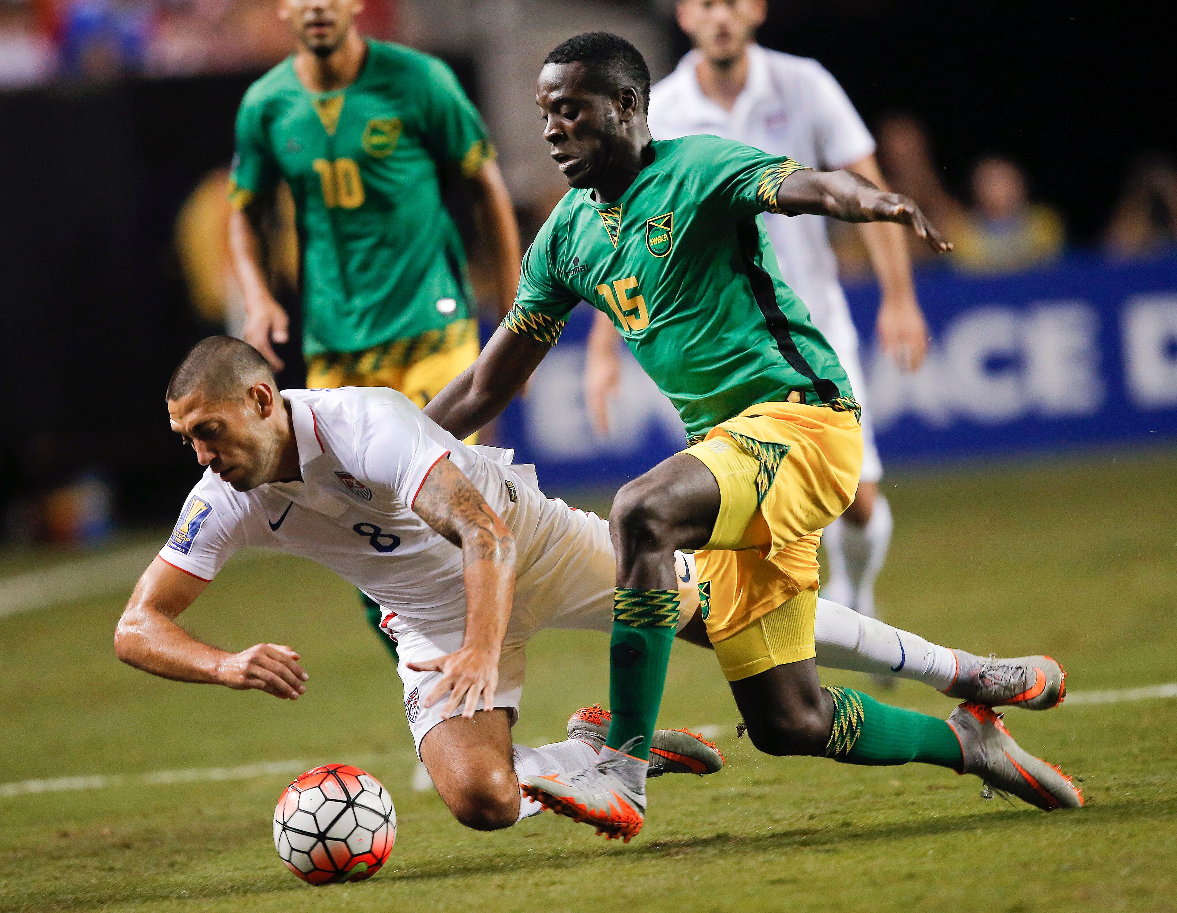 United States' Clint Dempsey (8) and Jamaica's Je-Vaughn Watson (15) vie for at the ball during the first half of a CONCACAF Gold Cup soccer semifinal, Wednesday, July 22, 2015, in Atlanta. (AP Photo/John Bazemore)