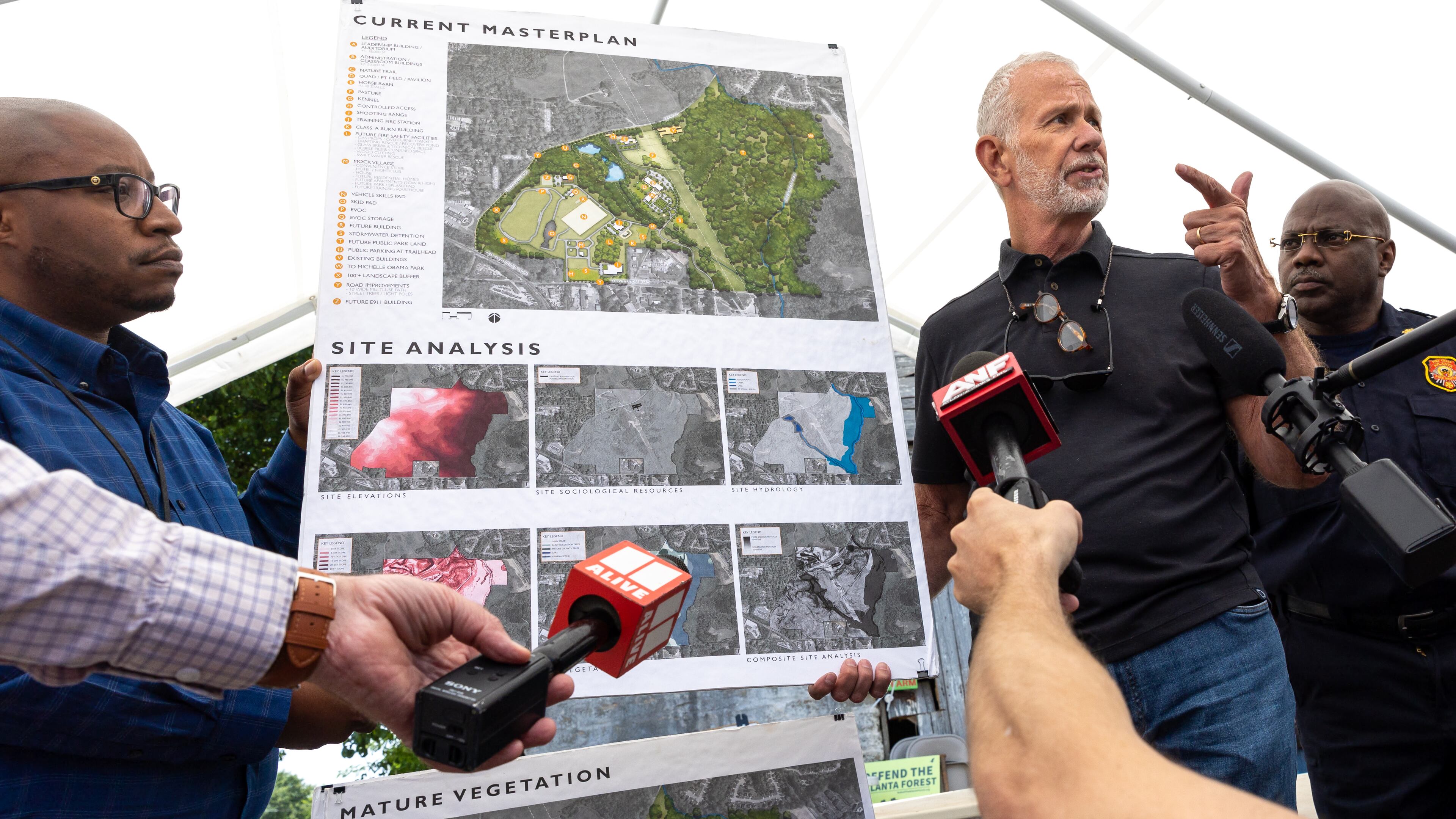 Bob Hughes, principal and founding partner of HGOR, speaks at a media tour of the site for the proposed Atlanta Public Safety Training Center on Friday, May 26, 2023. HGOR is the master planner of the site. (Arvin Temkar / arvin.temkar@ajc.com)