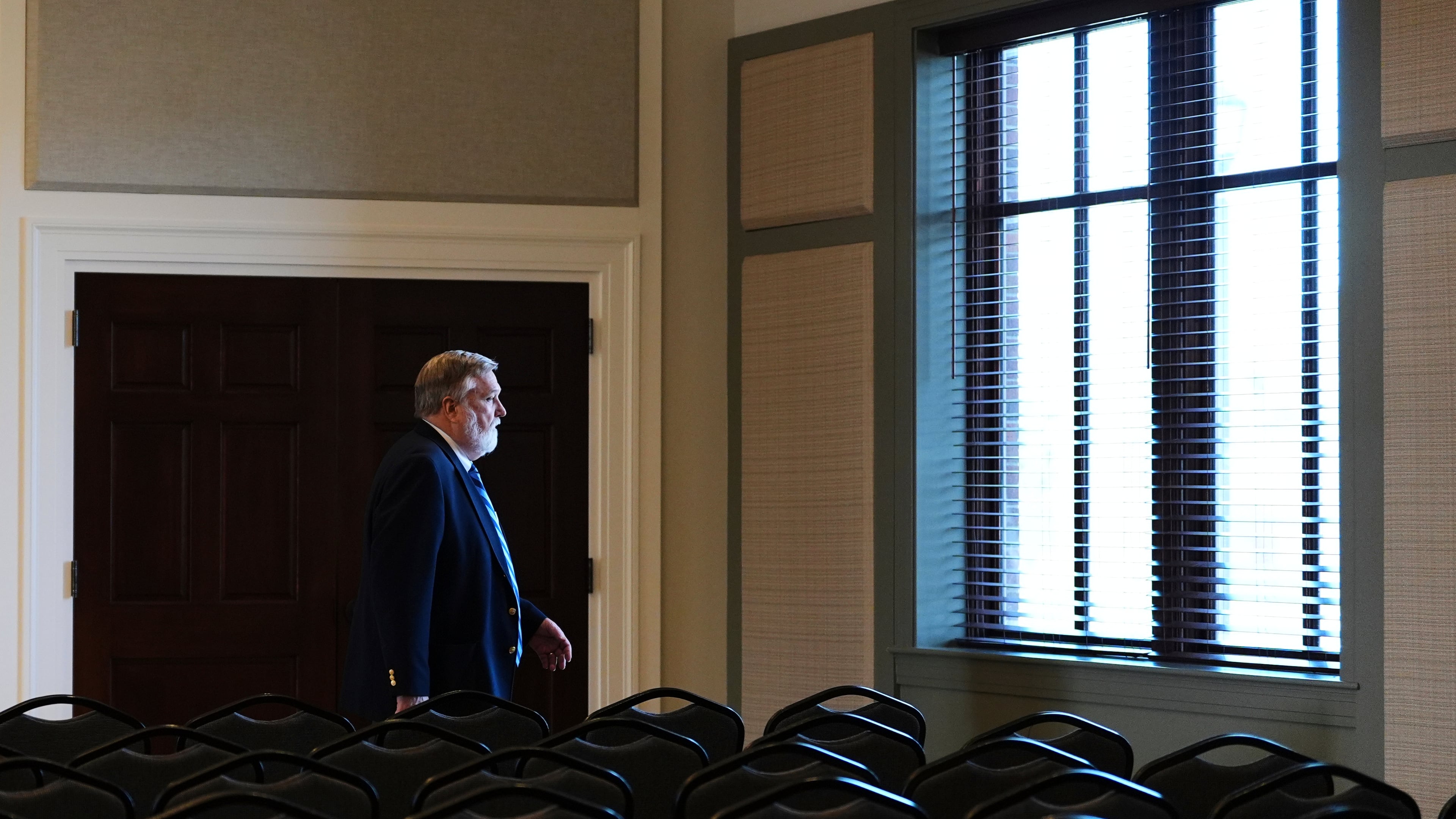 FILE - Pastor Doug Wilson walks through the church hall after Sunday services at the new campus for Christ Church and its Logos School, Sunday, April 6, 2025, in Moscow, Idaho. (AP Photo/Lindsey Wasson, File)