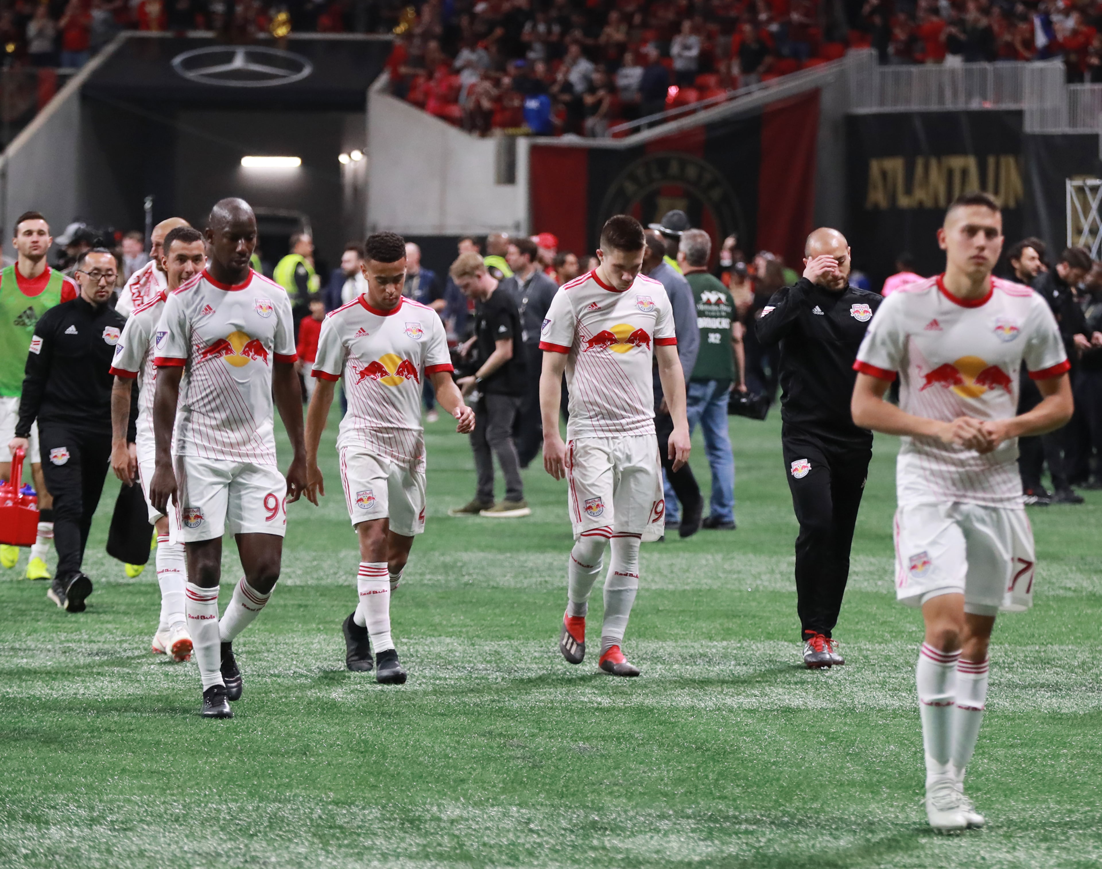 The New York Red Bulls walk off the field dejected after falling to the Atlanta United 3-0 in their Eastern Conference finals MLS soccer game on Sunday, Nov. 25, 2018, in Atlanta. Curtis Compton/ccompton@ajc.com