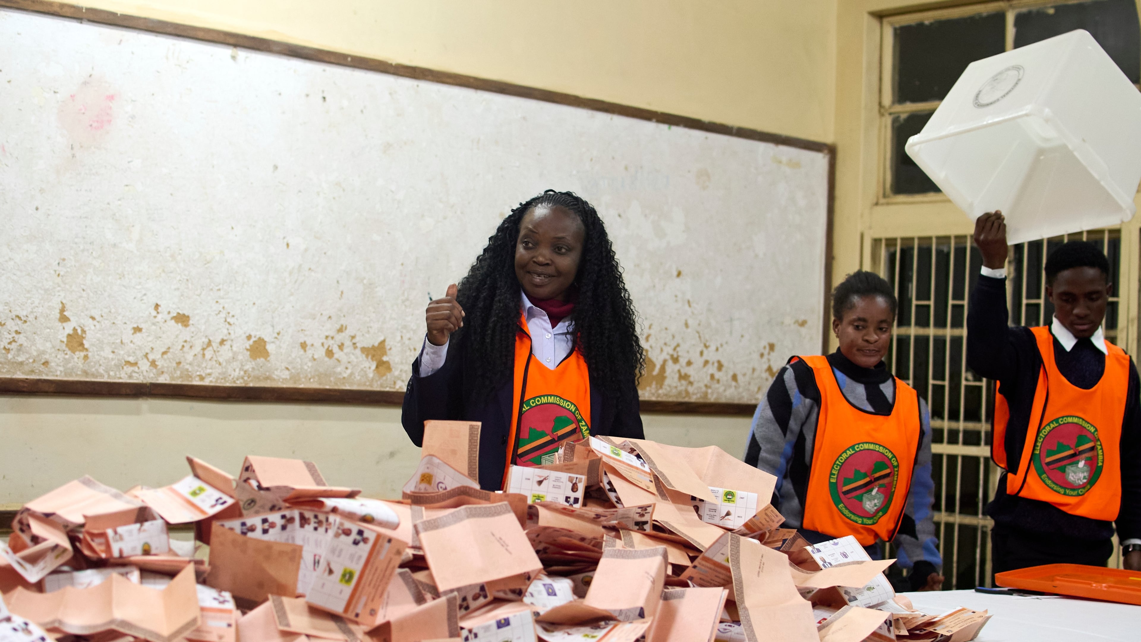 Election workers count ballots at a polling station in Lusaka, South Africa, Thursday, Aug. 13, 2026. (AP Photo/Alfonso Nqunjana)