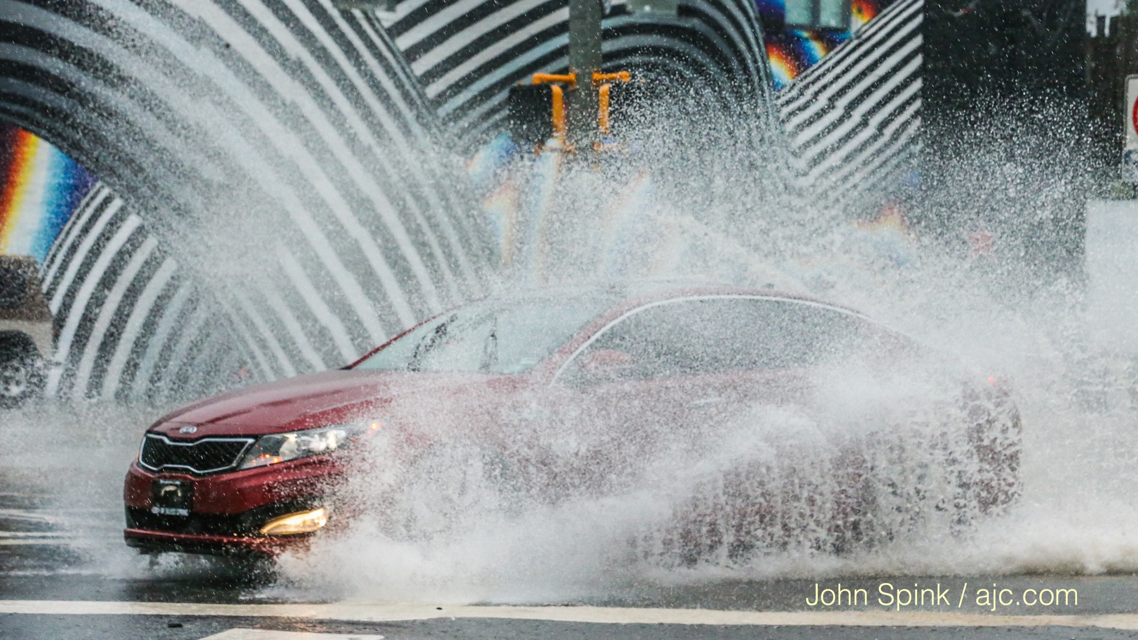 Cars run through standing water at Boulevard in Edgewood.