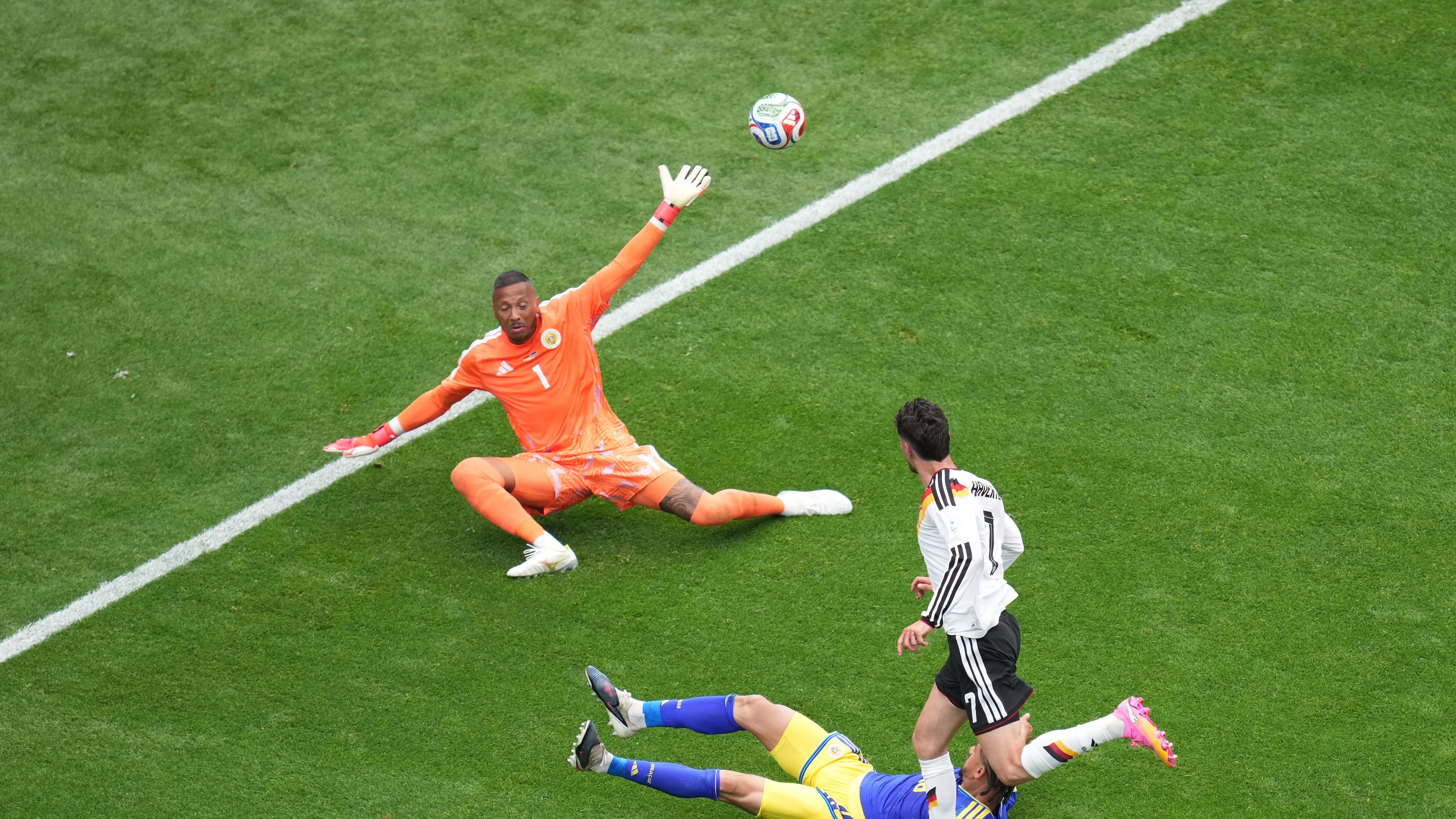 Germany's Kai Havertz (7) scores a goal against Curaçao goalkeeper Eloy Room (1) during the World Cup Group E soccer match between Germany and Curacao in Houston, Sunday, June 14, 2026. (AP Photo/Eric Smith)