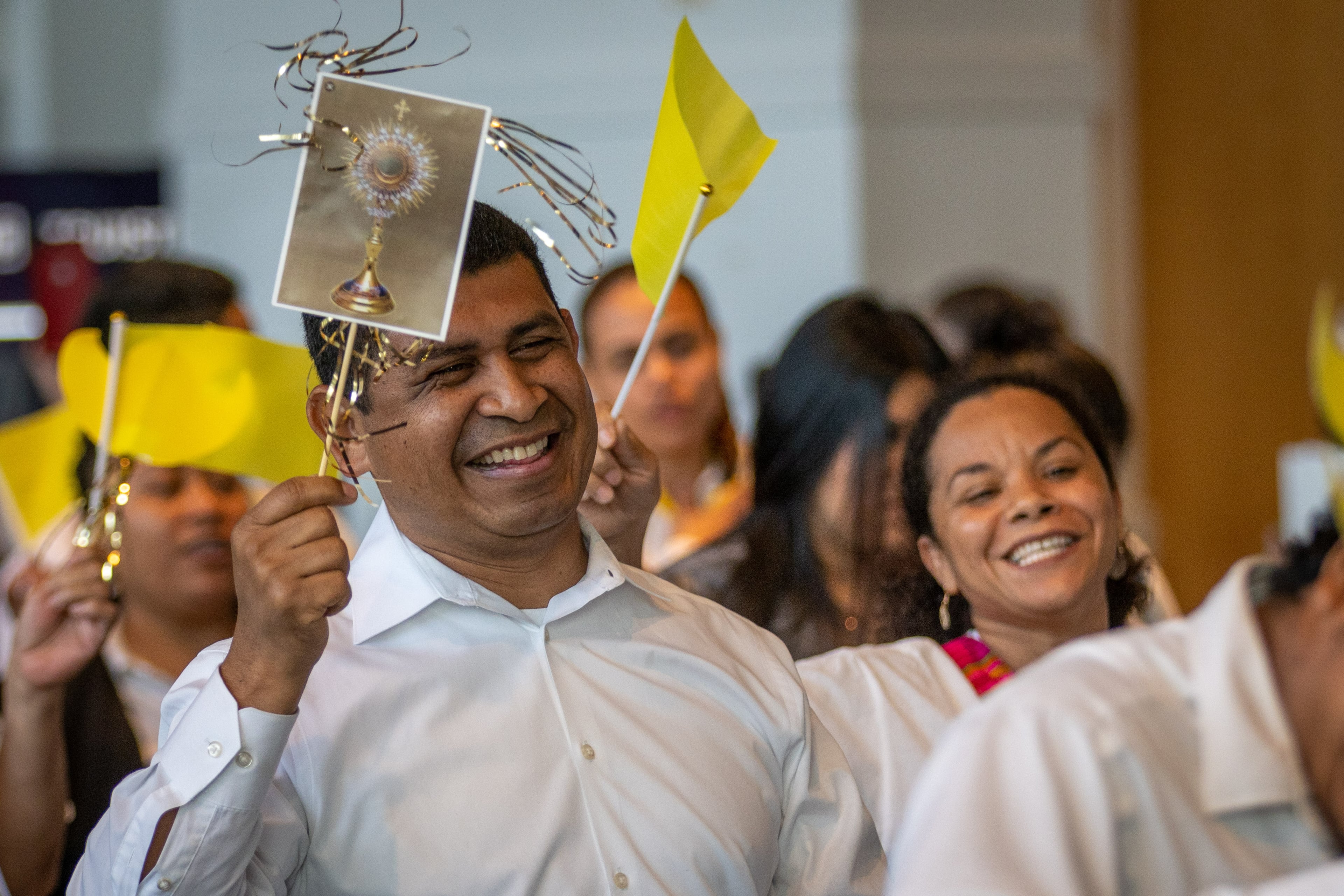 Groups walk through the Georgia International Convention Center in College Park at the beginning of the 25th Eucharistic Congress Saturday, June 18, 2022. (Steve Schaefer / steve.schaefer@ajc.com)