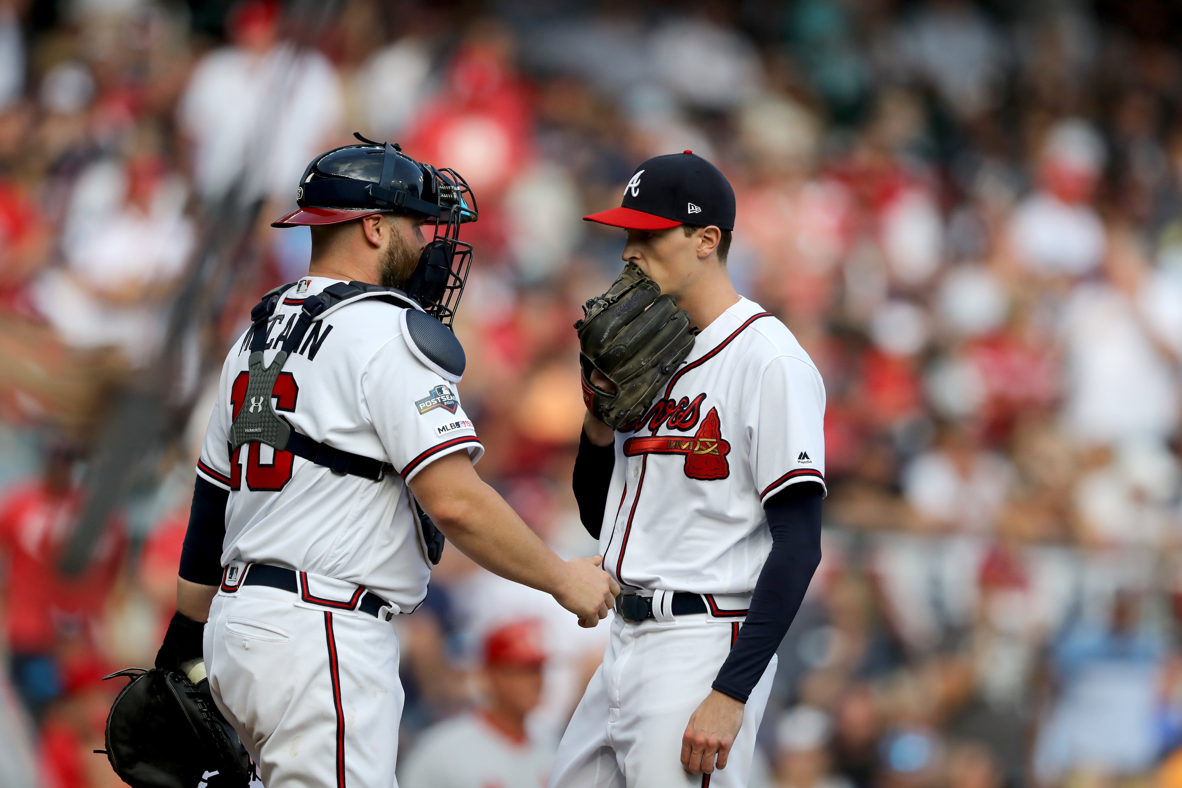 Braves catcher Brian McCann (16) talks with relief pitcher Max Fried (54). Curtis Compton/ccompton@ajc.com