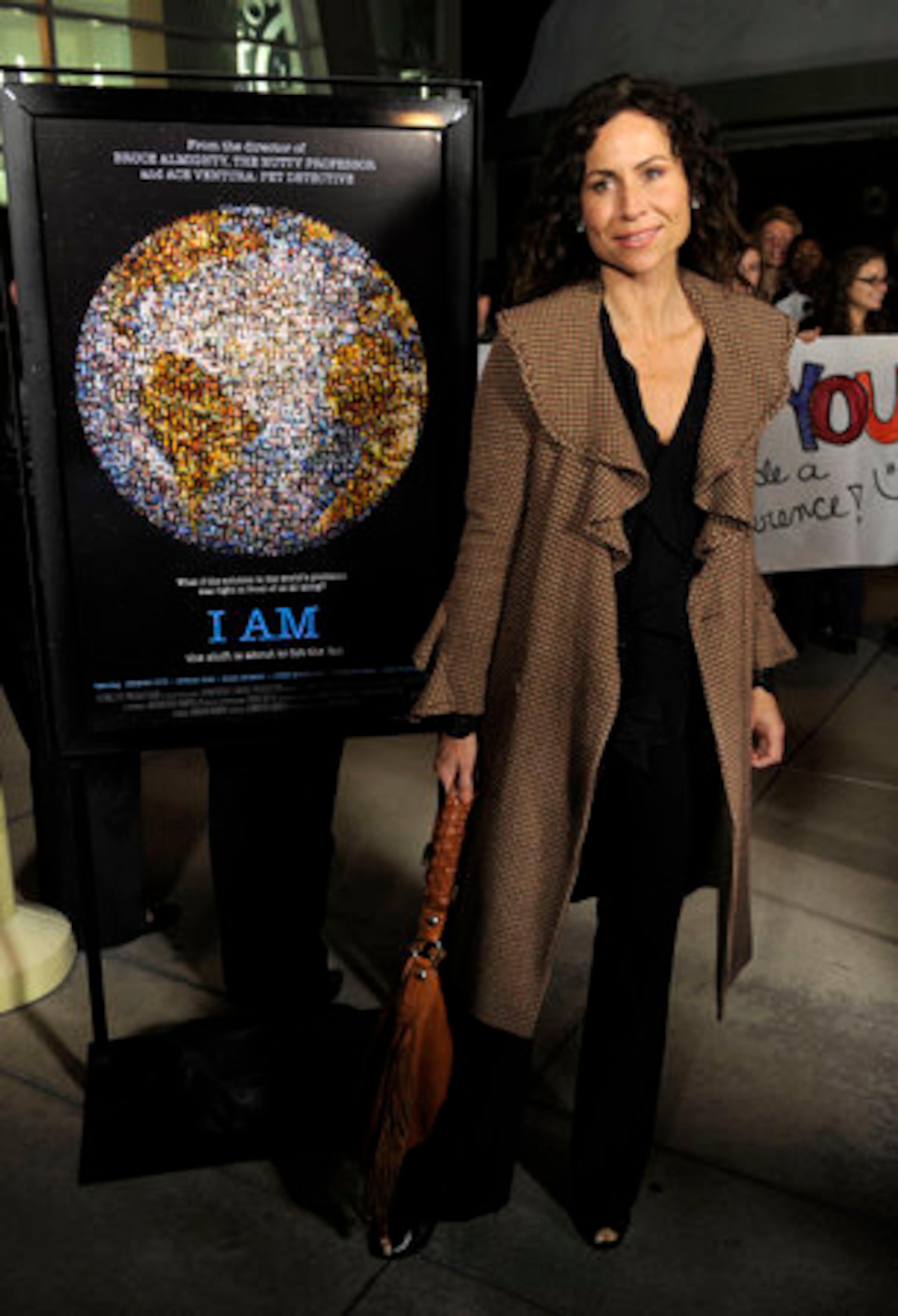Actress Minnie Driver poses at the premiere of the documentary film "I Am" in Los Angeles, Tuesday, March 8, 2011.