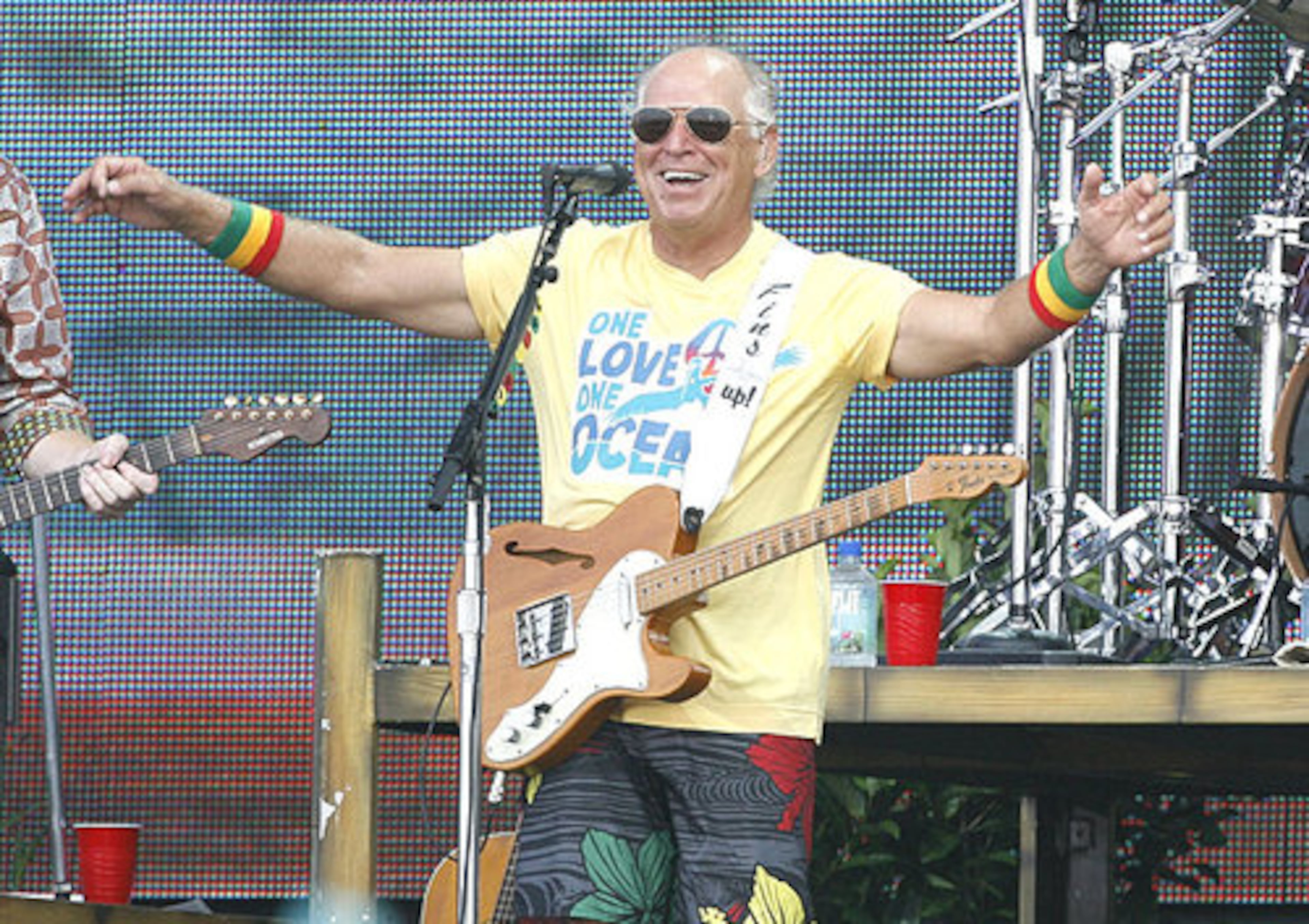 Jimmy Buffett performs Sunday, July 11, 2010 in Gulf Shores, Ala. The free concert attended by tens of thousands of people was meant to help the Gulf Coast through the oil spill crisis.