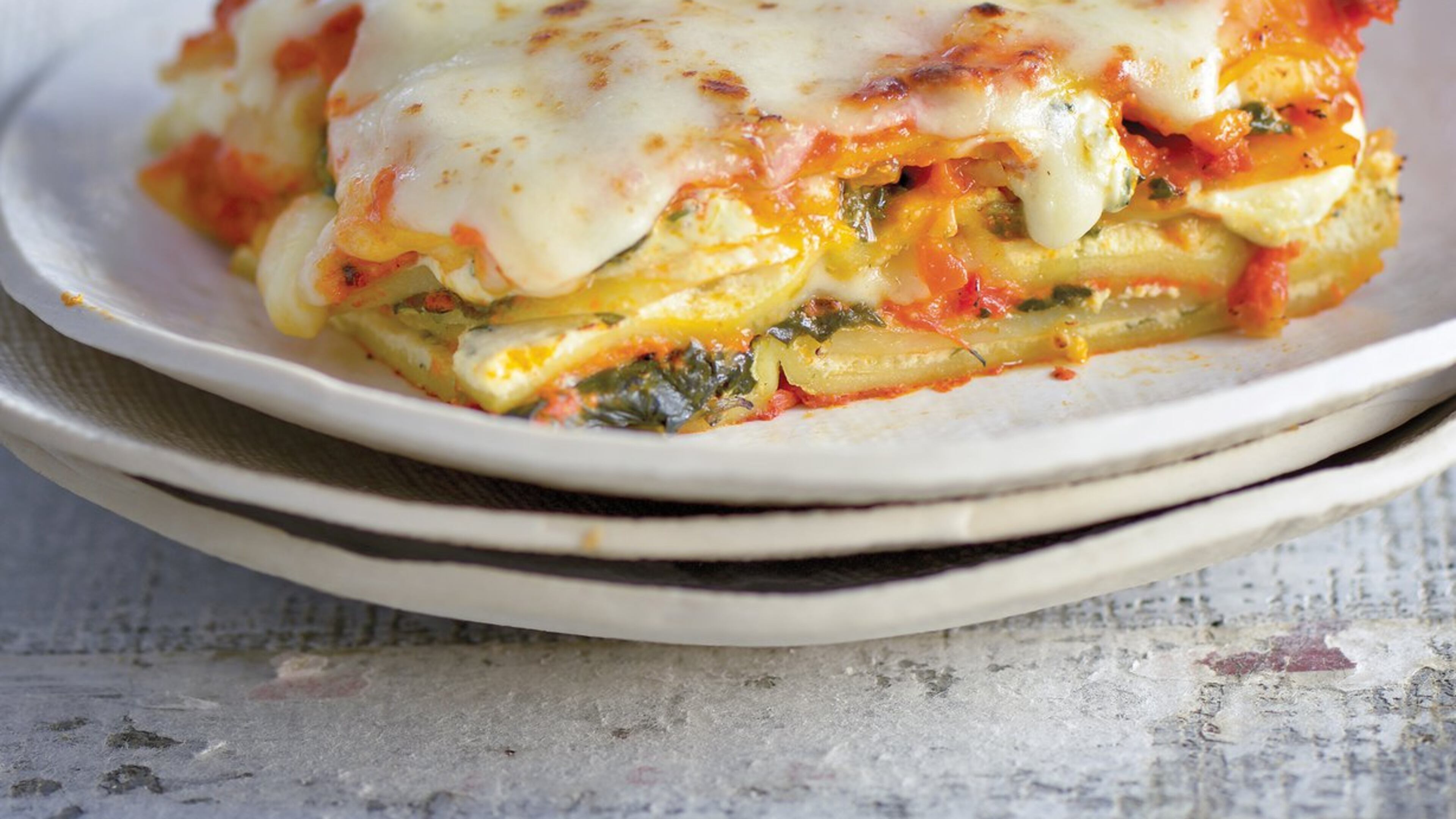 Thinly sliced potatoes add heft, texture and flavor to a traditional lasagna, one of the many dishes in Raghavan Iyer’s new book. Contributed by Matthew Benson