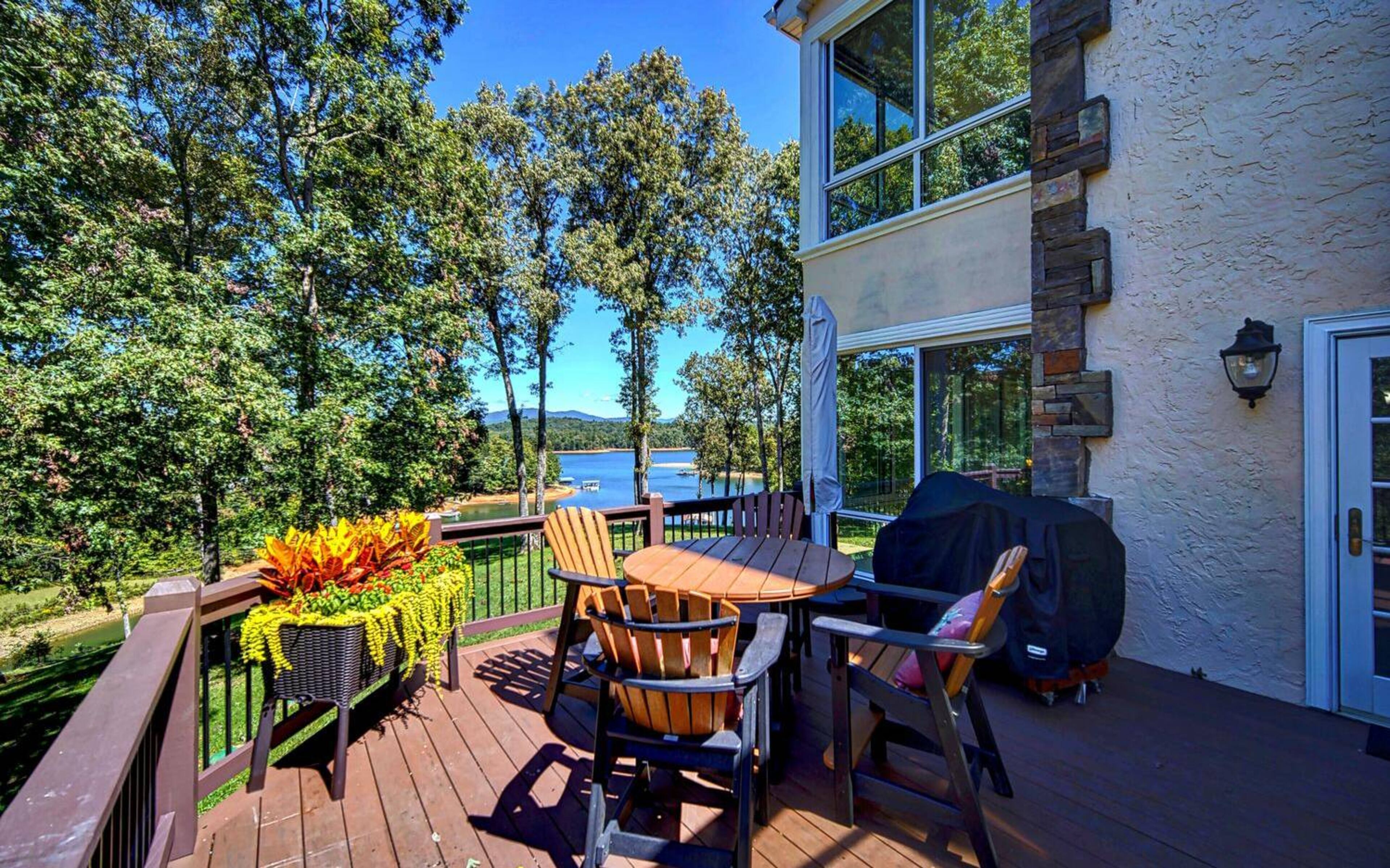 Deck overlooking the spacious yard and beautiful lake.