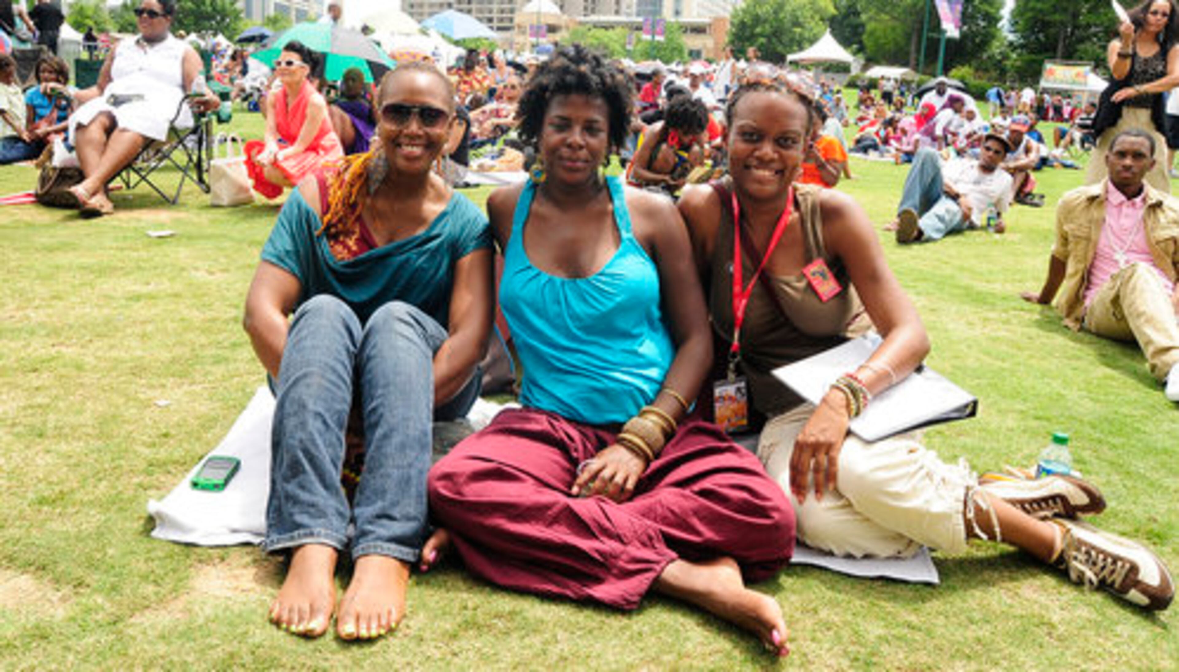 Friends Jen Farris, Dia Johnson and Jodine Dorce enjoy the day in Centennial Park.