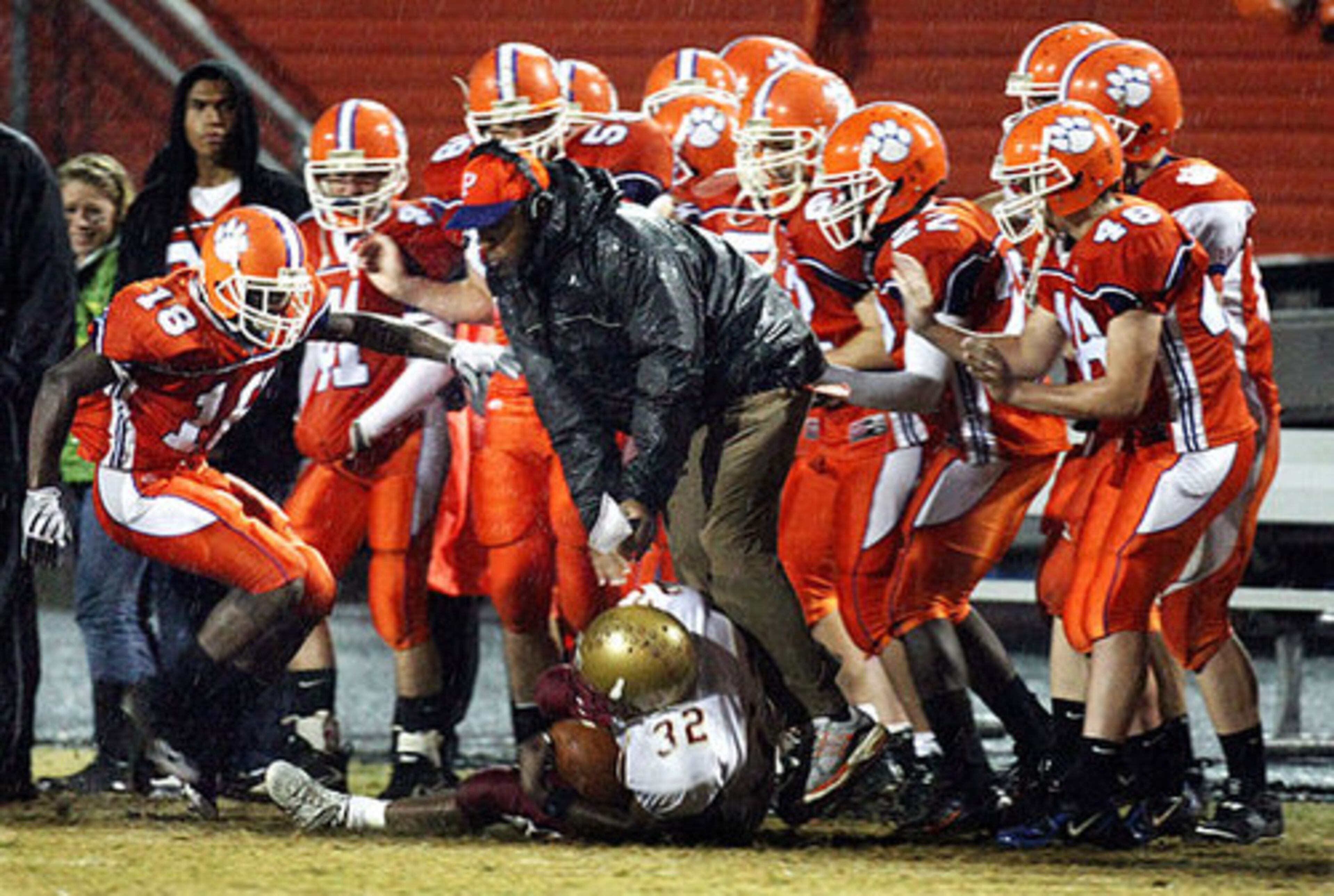 Brookwood running back #32 Allen McCray finds himself surrounded by a host of Panthers as he is knocked out of bounds by Parkview defensive back #18 Christian Newsome.
