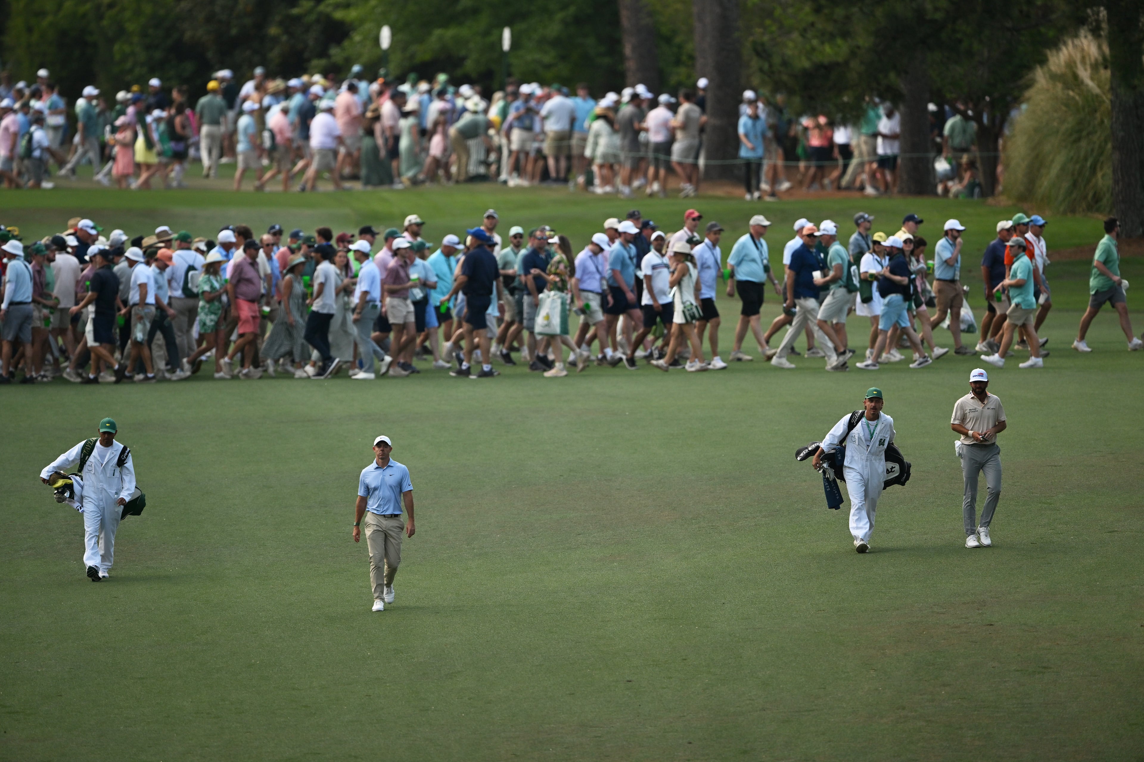 Rory McIlroy and Cameron Young walk up seventh fairway during final round of the Masters, at Augusta National Golf Club, Sunday, April 12, 2026, in Augusta, GA (Hyosub Shin/AJC)