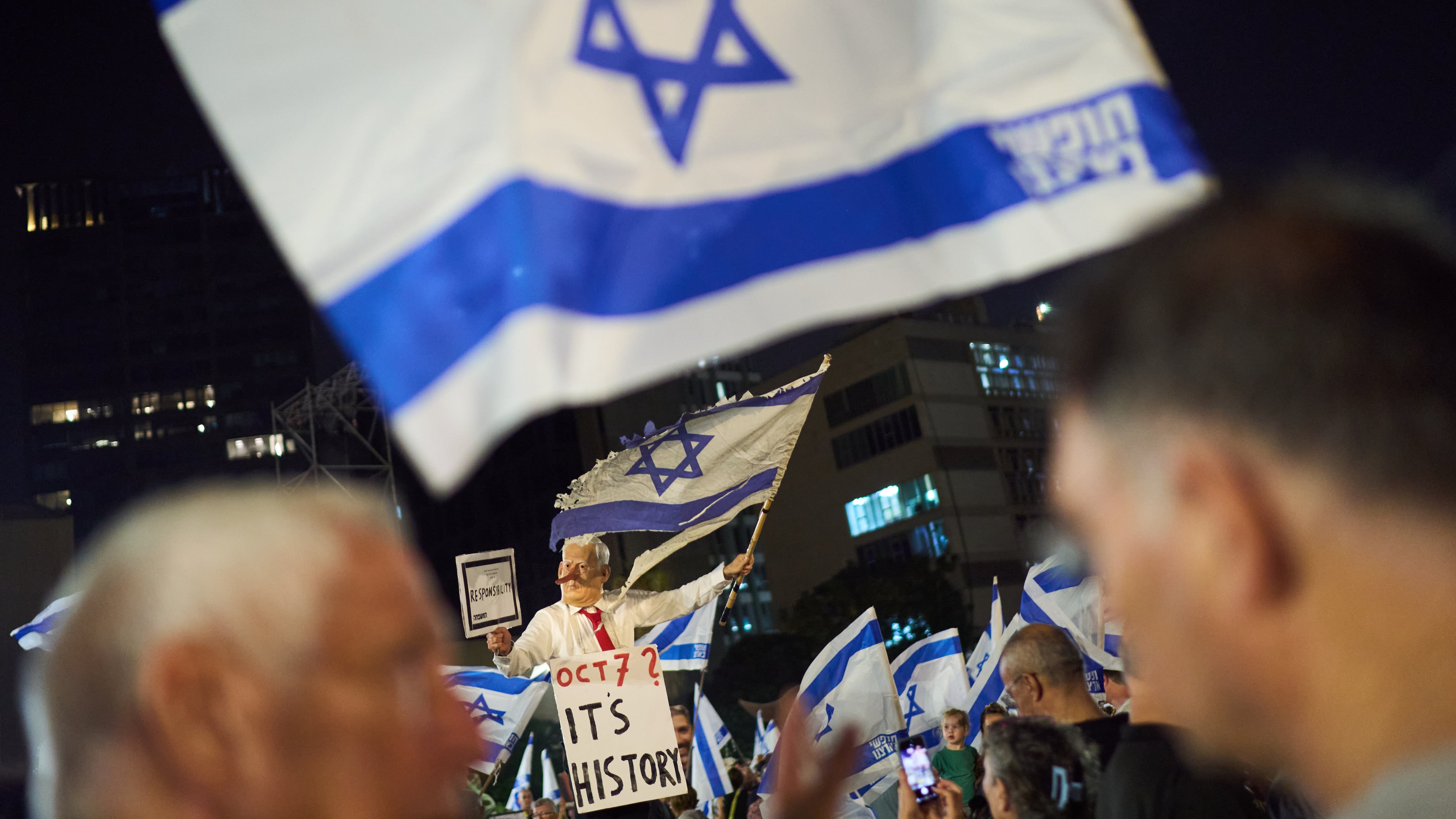 A demonstrator wearing a mask depicting Israeli Prime Minister Benjamin Netanyahu attends an anti-government protest ahead of Israel's general election, Saturday, Oct. 24, 2026, in Tel Aviv, Israel. (AP Photo/David Goldman)
