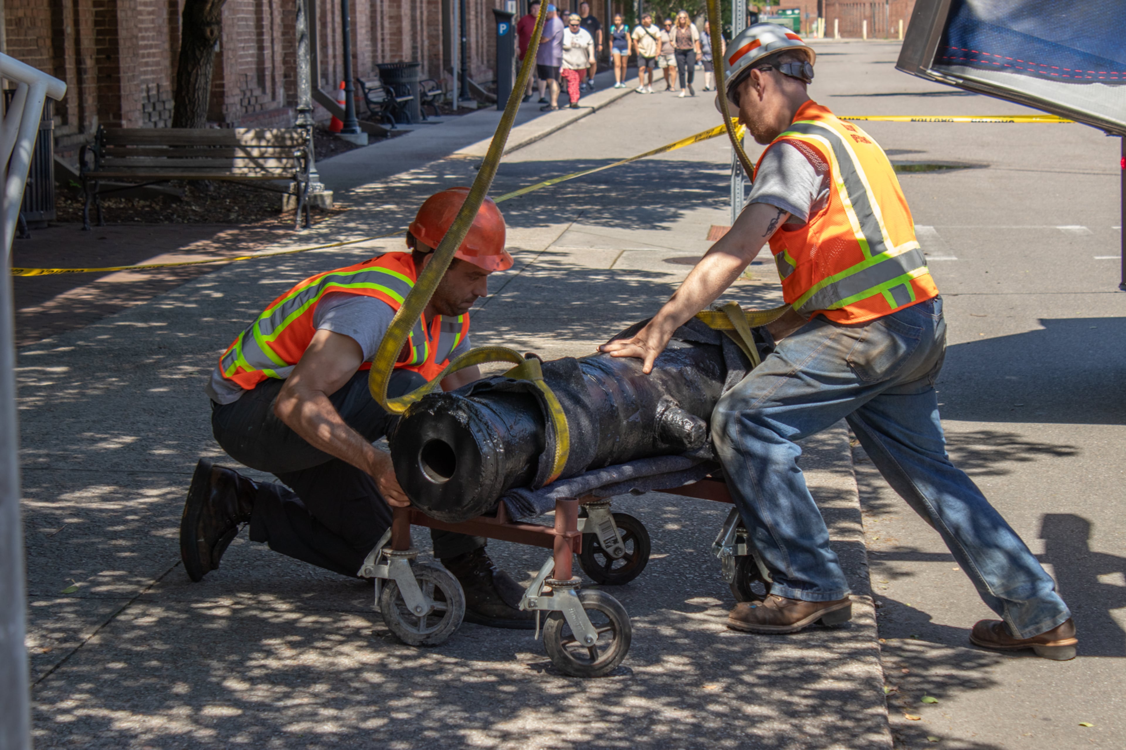 Workers prep one of the Revolutionary War cannons recovered from the Savannah River in 2021 for installation in the Savannah History Museum's new "Loyalists & Liberty" exhibit. (Courtesy of Coastal Heritage Society)