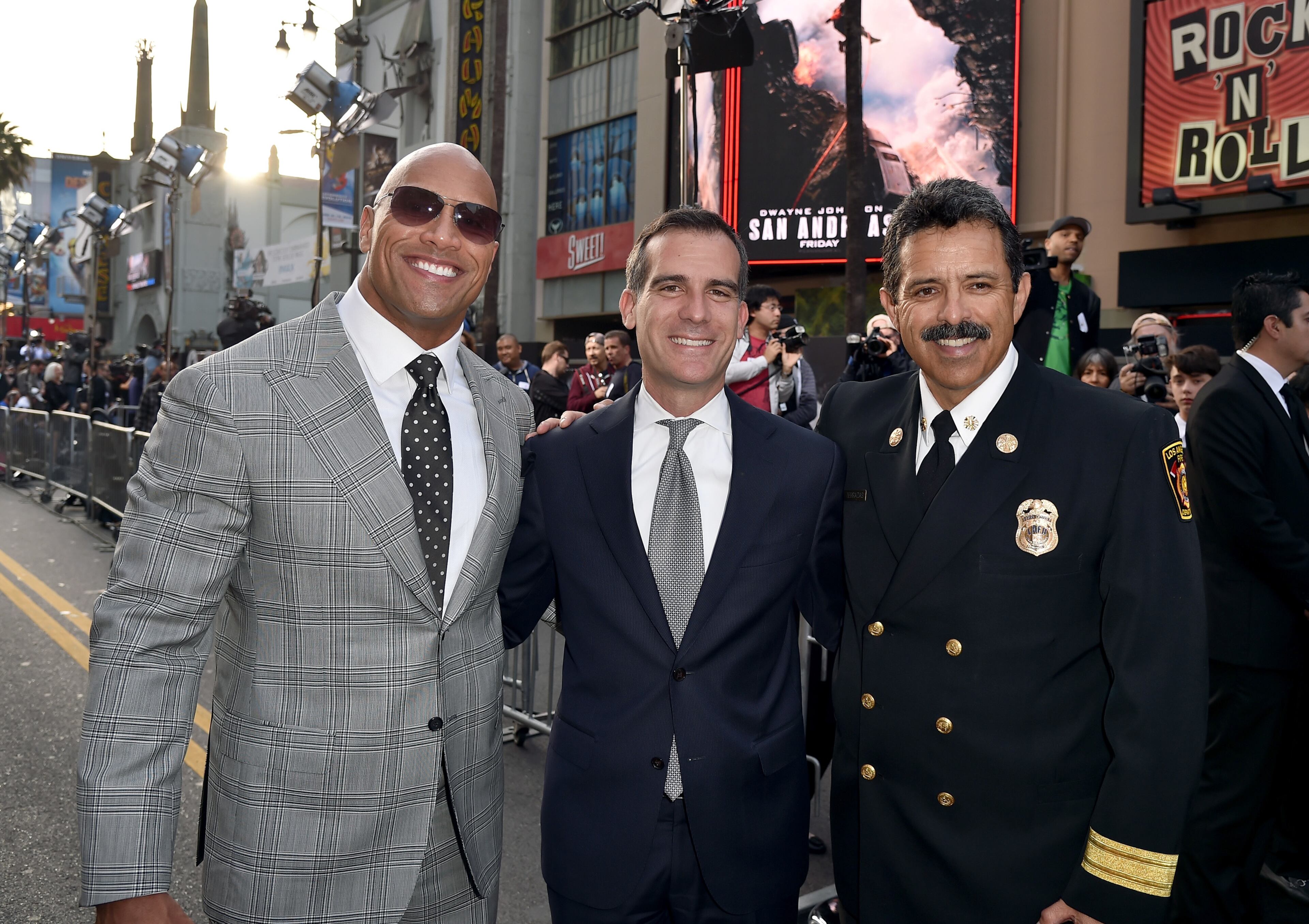 HOLLYWOOD, CA - MAY 26: (L-R) Actor Dwayne "The Rock" Johnson, Mayor of Los Angeles Eric Garcetti and Los Angeles Fire Department Chief Ralph Terrazas arrive at the premiere of Warner Bros. Pictures' "San Andreas" at TCL Chinese Theatre on May 26, 2015 in Hollywood, California. (Photo by Kevin Winter/Getty Images)