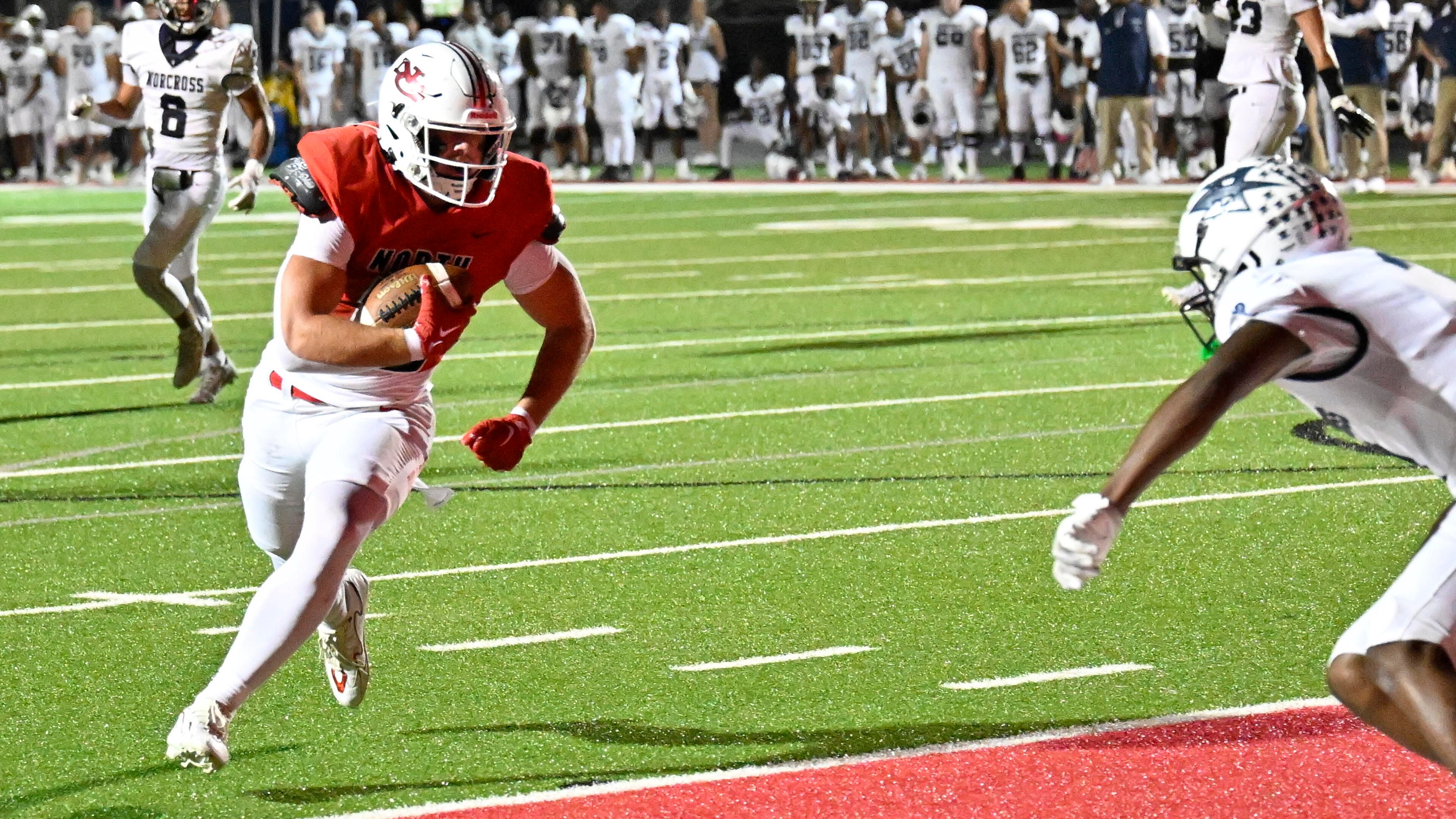 N. Gwinnett Ken Clark (10) runs for a touchdown during the first half of a GHSA region football game against Norcross in Suwanee, GA., on Friday, Oct. 25, 2024. (Jim Blackburn for the AJC)