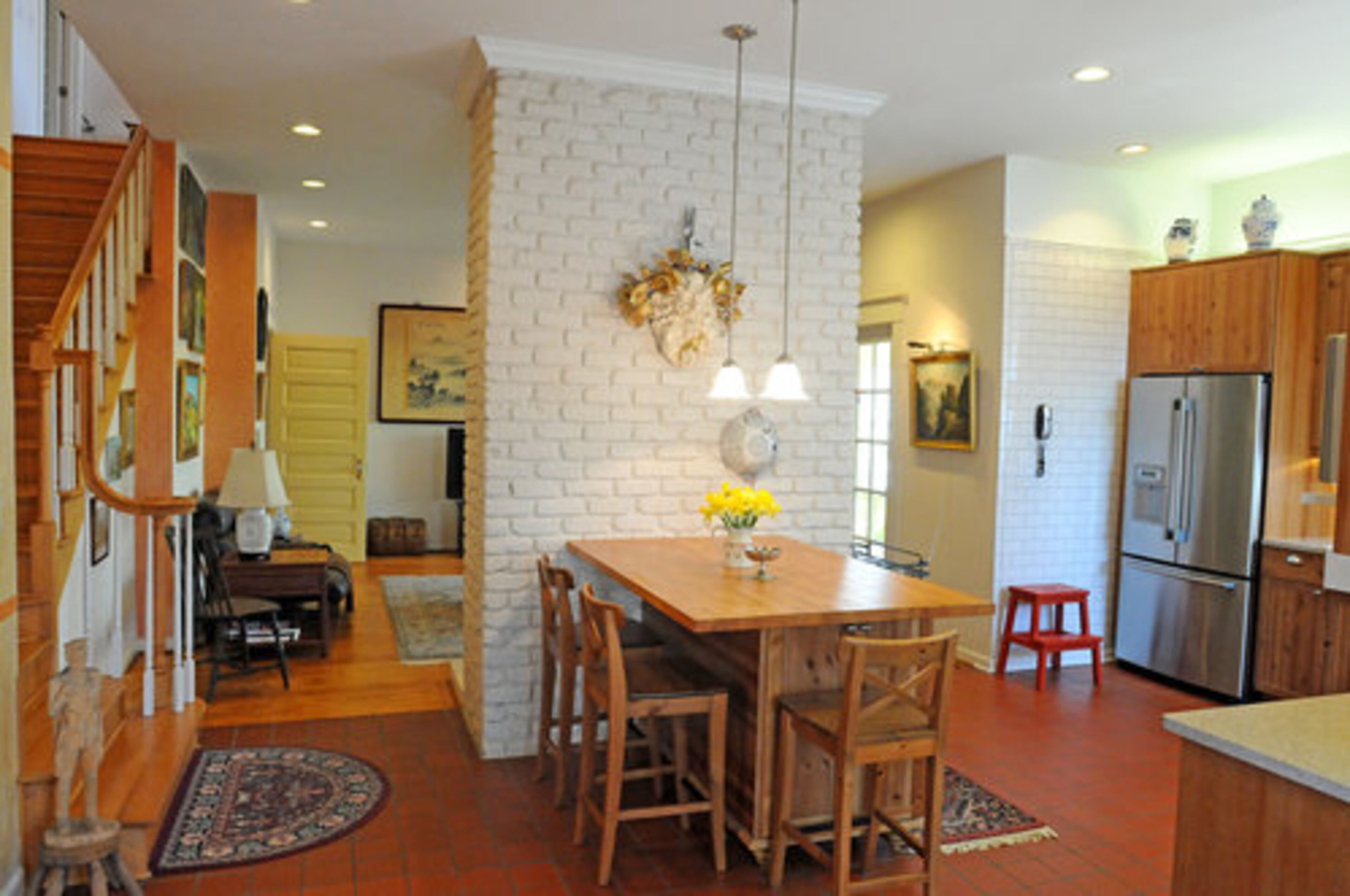 View of the rustic breakfast area that is situated between the kitchen and the staircase. The home also has a formal dining room. Christopher Oquendo/AJC FILE