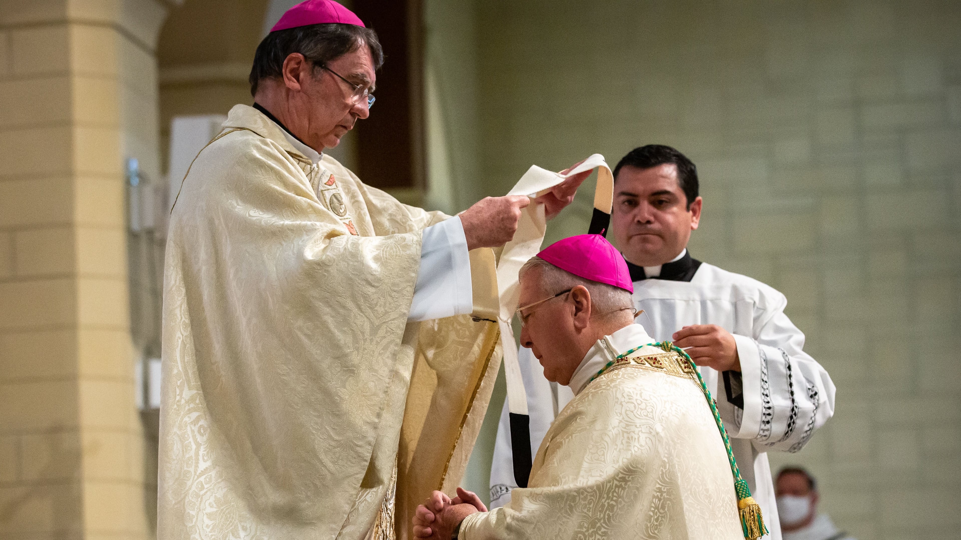 Archbishop Gregory J. Hartmayer receives the sacred pallium, which is blessed by the pope, from the apostolic nuncio, Archbishop Christophe Pierre, in a ceremony at the St. Peter Chanel Catholic Church in Roswell Wednesday, Oct. 7, 2020. Pope Francis decided in 2015 that new archbishops would receive the pallium in their home diocese instead of in Rome. (Steve Schaefer for The Atlanta Journal-Constitution)