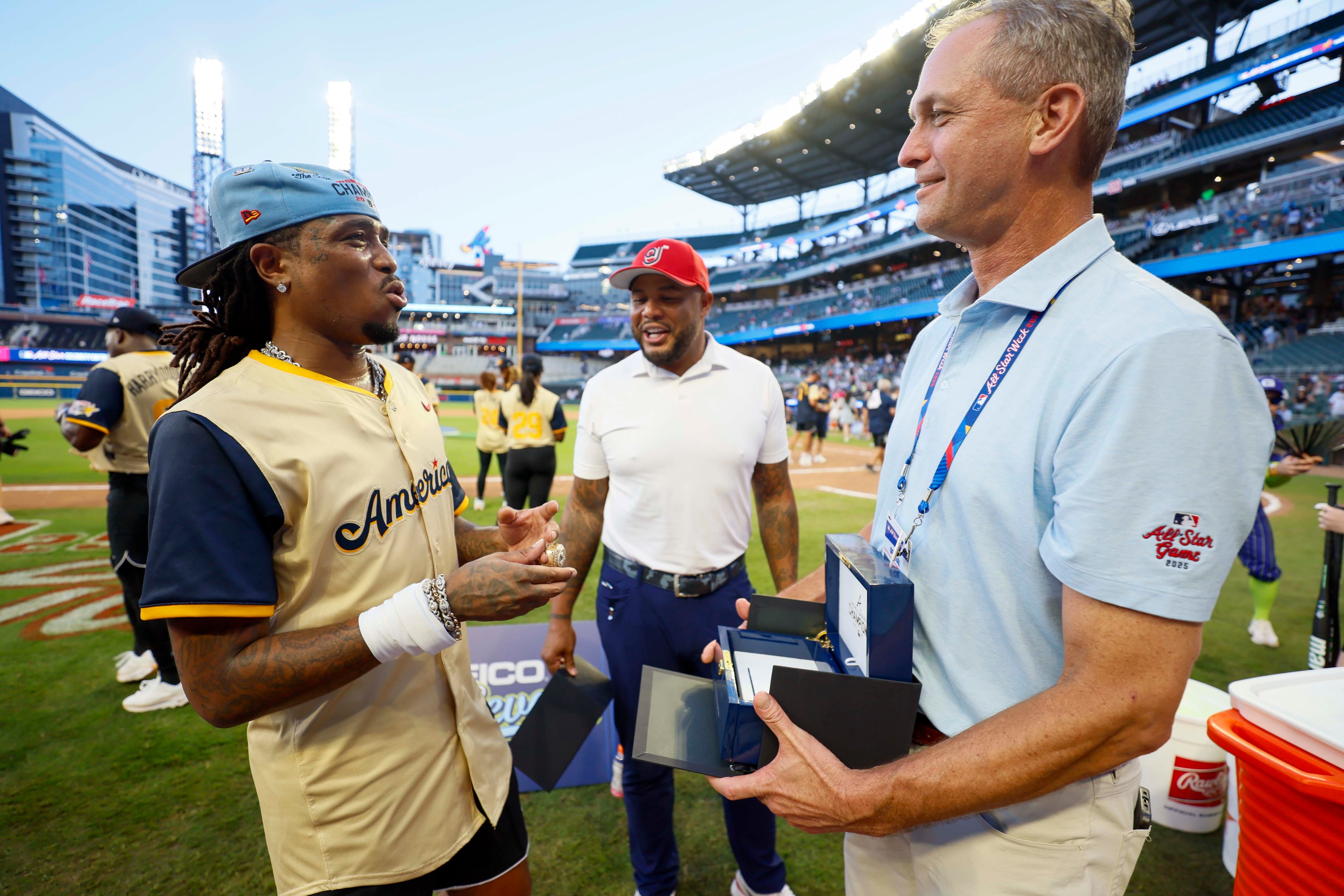 After the MLB All-Star Celebrity Game, Derek Schiller, President & CEO of the Atlanta Braves, along with former Atlanta Braves Andrew Jones, surprises Atlanta rapper Quavo with a 2021 Atlanta Braves championship ring at Truist Park on Saturday, July 12, 2025, in Atlanta.
(Miguel Martinez/ AJC)