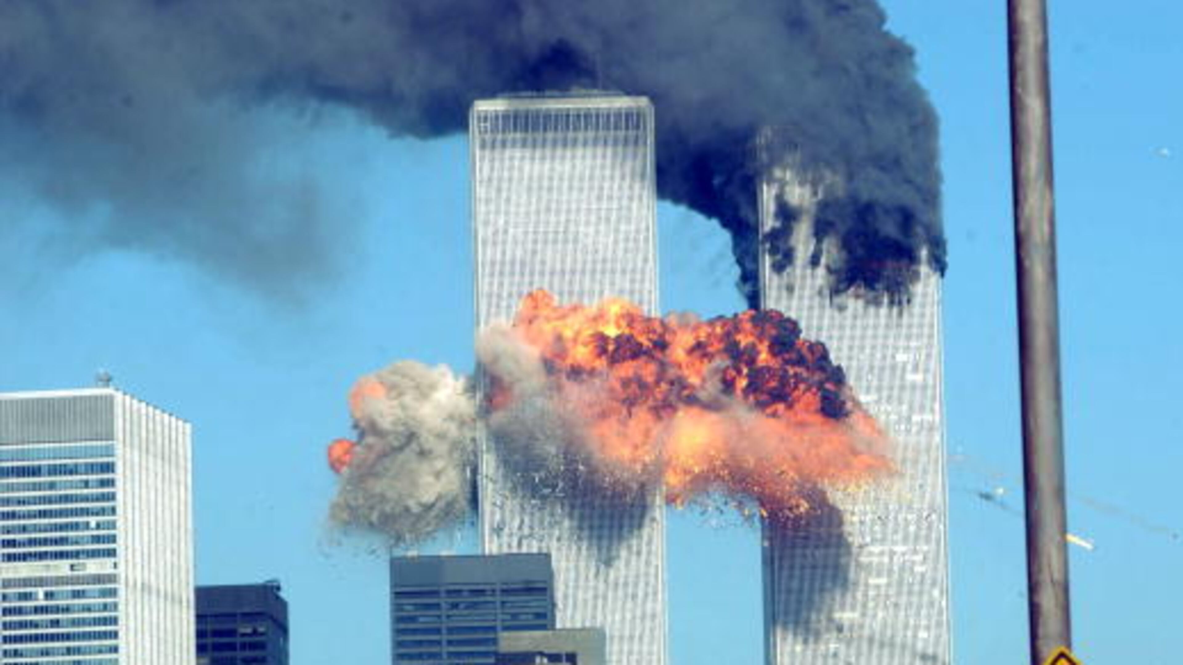 394261 14: A fiery blasts rocks the World Trade Center after being hit by two planes September 11, 2001 in New York City. (Photo by Spencer Platt/Getty Images)