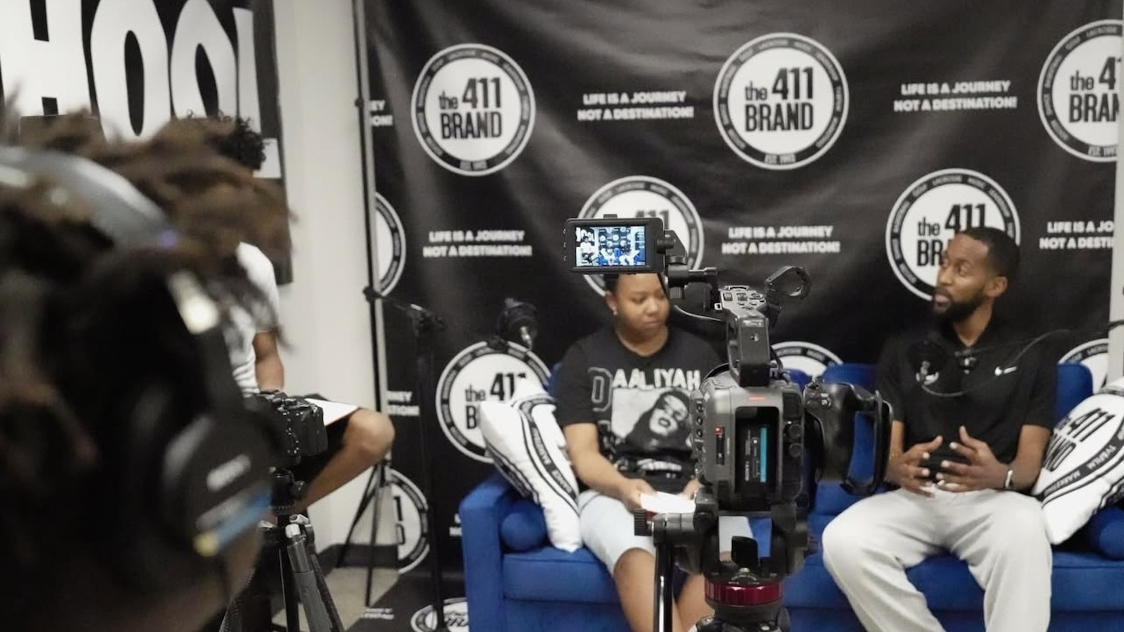 Paris Giles, 15 (left), interviews a guest for a class podcast at The 411 Brand Saturday School in Atlanta. The 411 Brand is a nonprofit offering innovative programming in education, entertainment and athletics to middle and high school students. (Courtesy of The 411 Brand)