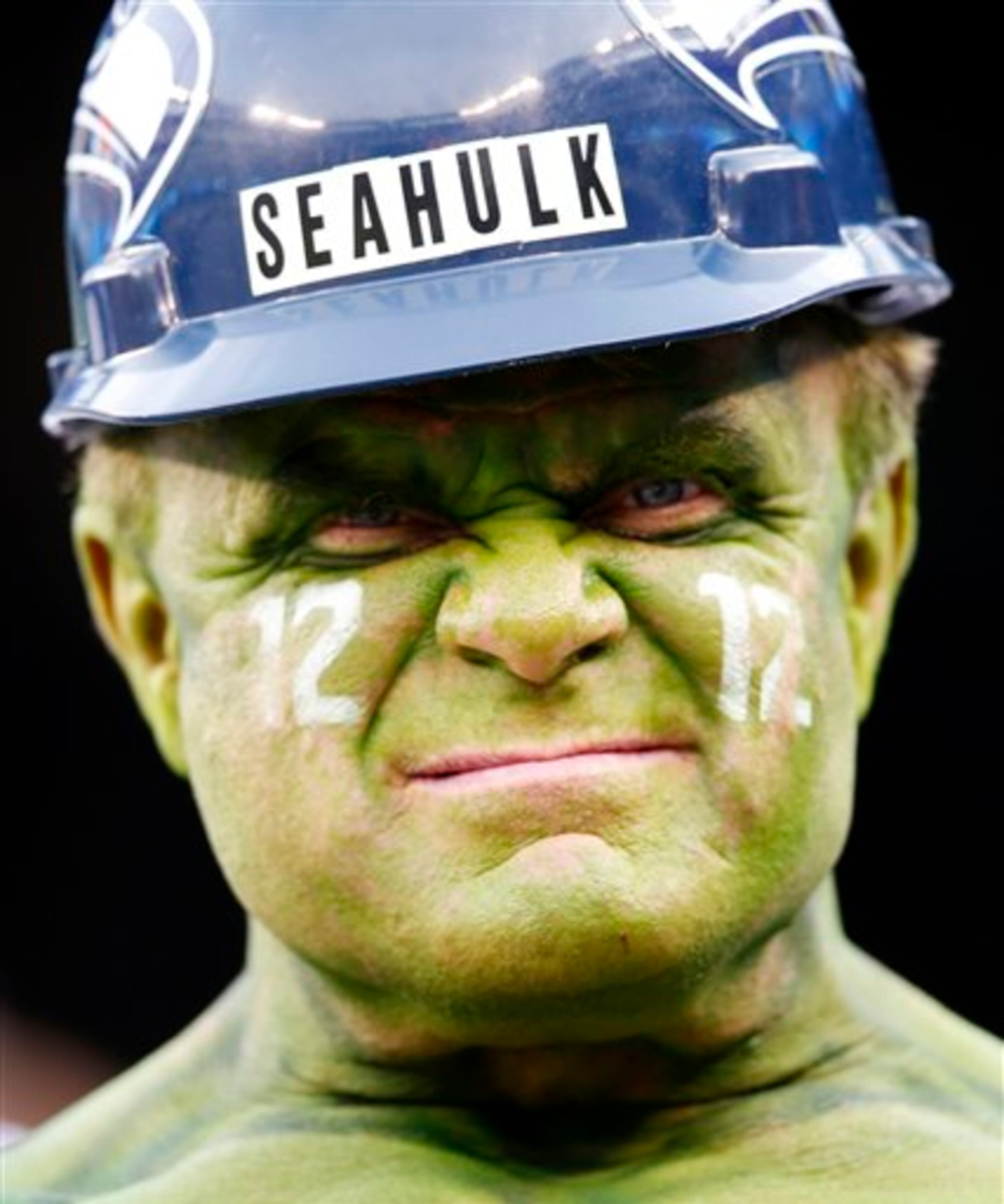 A Seattle Seahawks fan poses before the NFL Super Bowl XLVIII football game between the Seahawks and the Denver Broncos, Sunday, Feb. 2, 2014, in East Rutherford, N.J. (AP Photo/Evan Vucci)