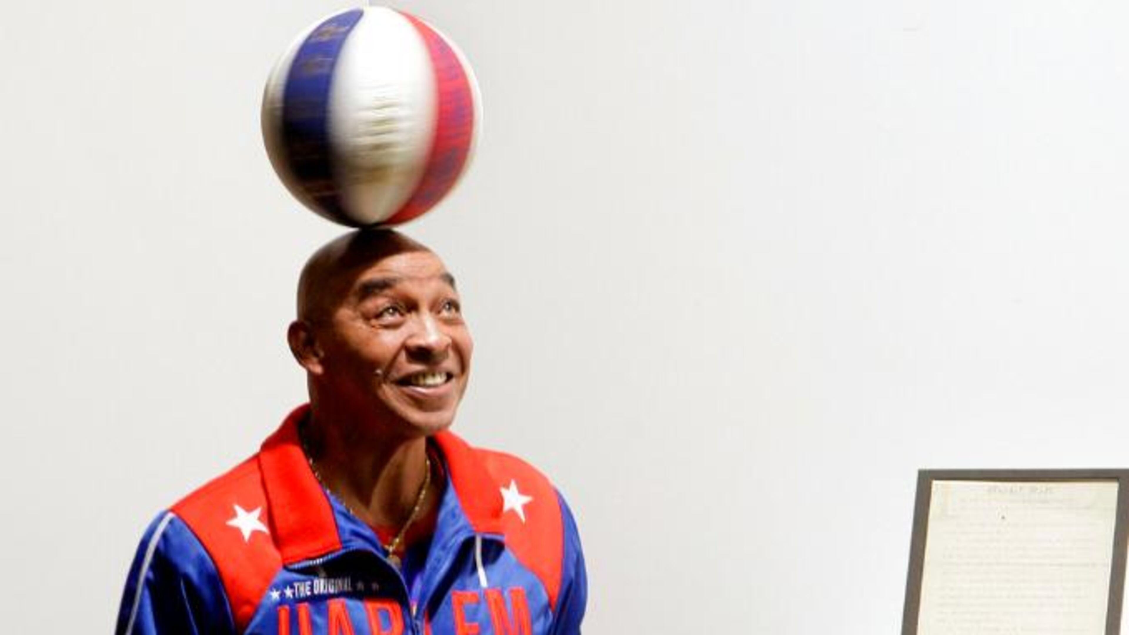 Fred “Curly” Neal, the dribbling wizard who entertained millions with the Harlem Globetrotters for parts of three decades, died Thursday at age 77.