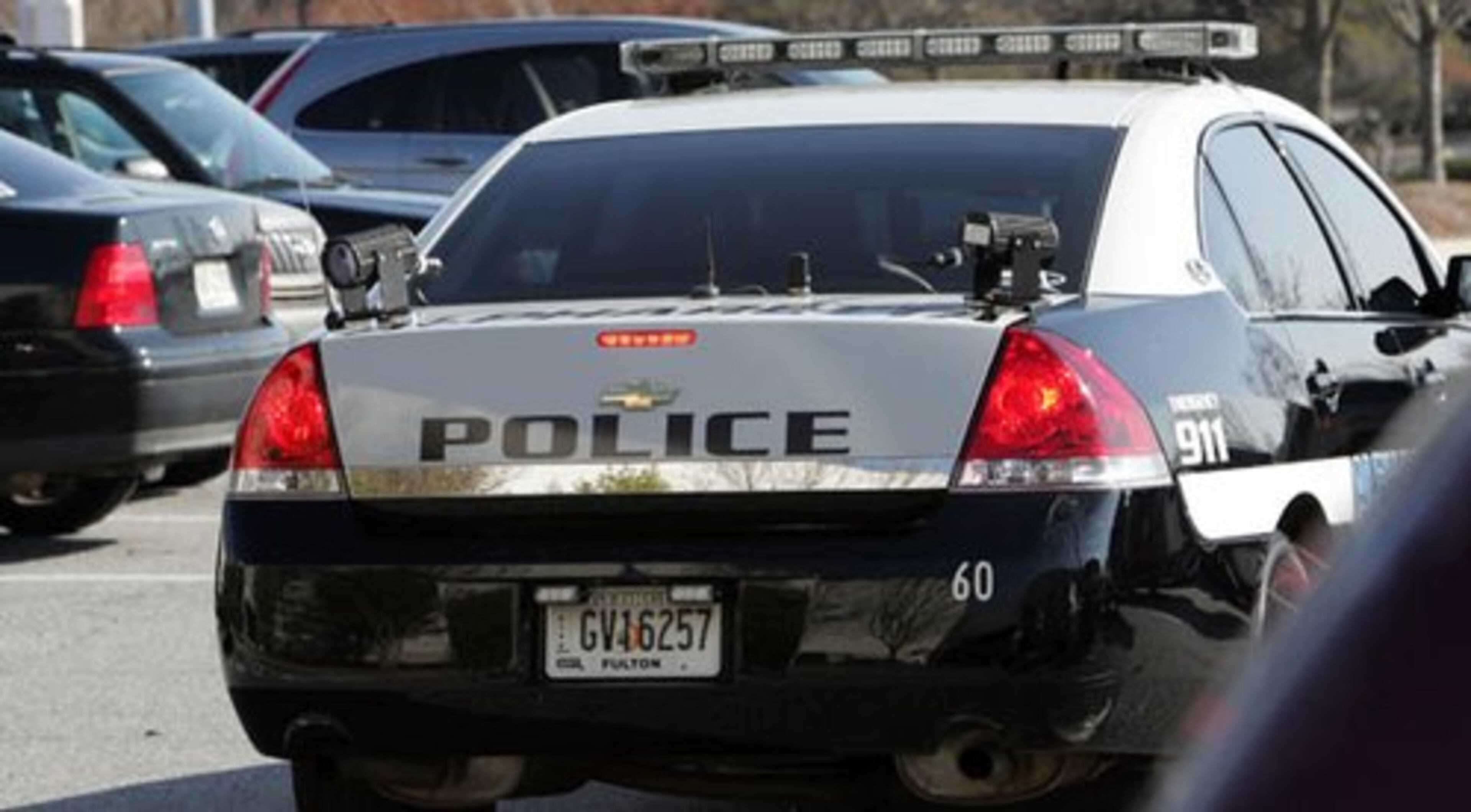 Alpharetta Police officer John Allen patrols the North Point Mall parking lot using an infrared cameras to rapidly scan license plates. Sandy Springs and Alpharetta have remote license plate readers, high-tech devices mounted on a car that can scan hundreds of license plates a minute.